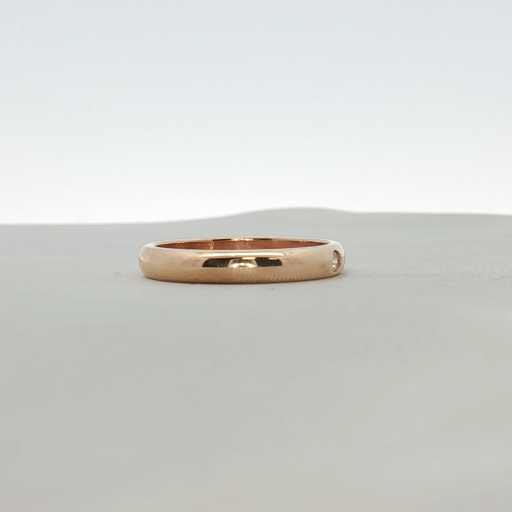 Cartier Love Wedding Band with diamond, gold jewelry featuring a sleek design and embedded sparkling diamond accents.