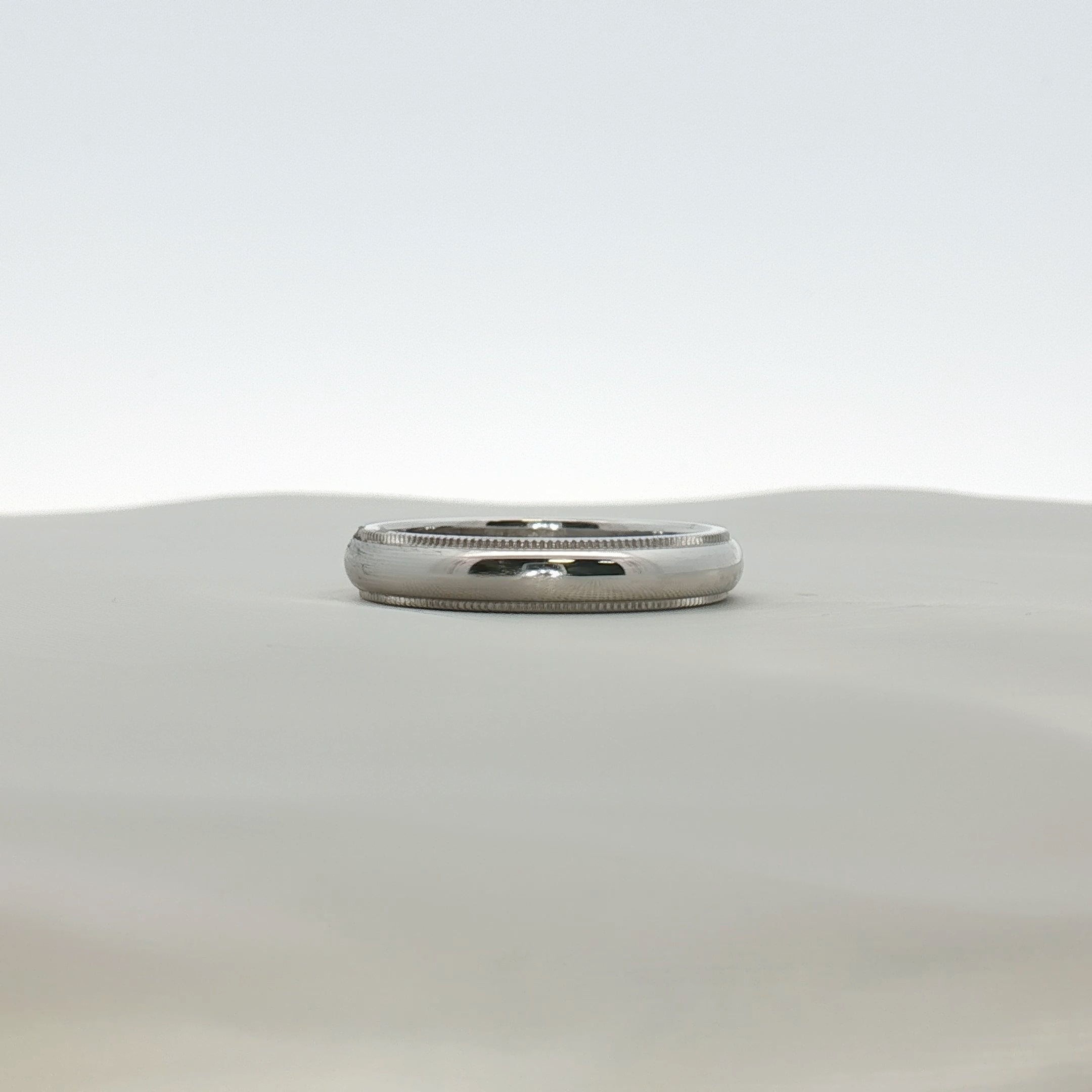 Gold & Beyond Tiffany & Co. Together wedding band jewelry in gold, showcasing a sleek, matching design for couples.