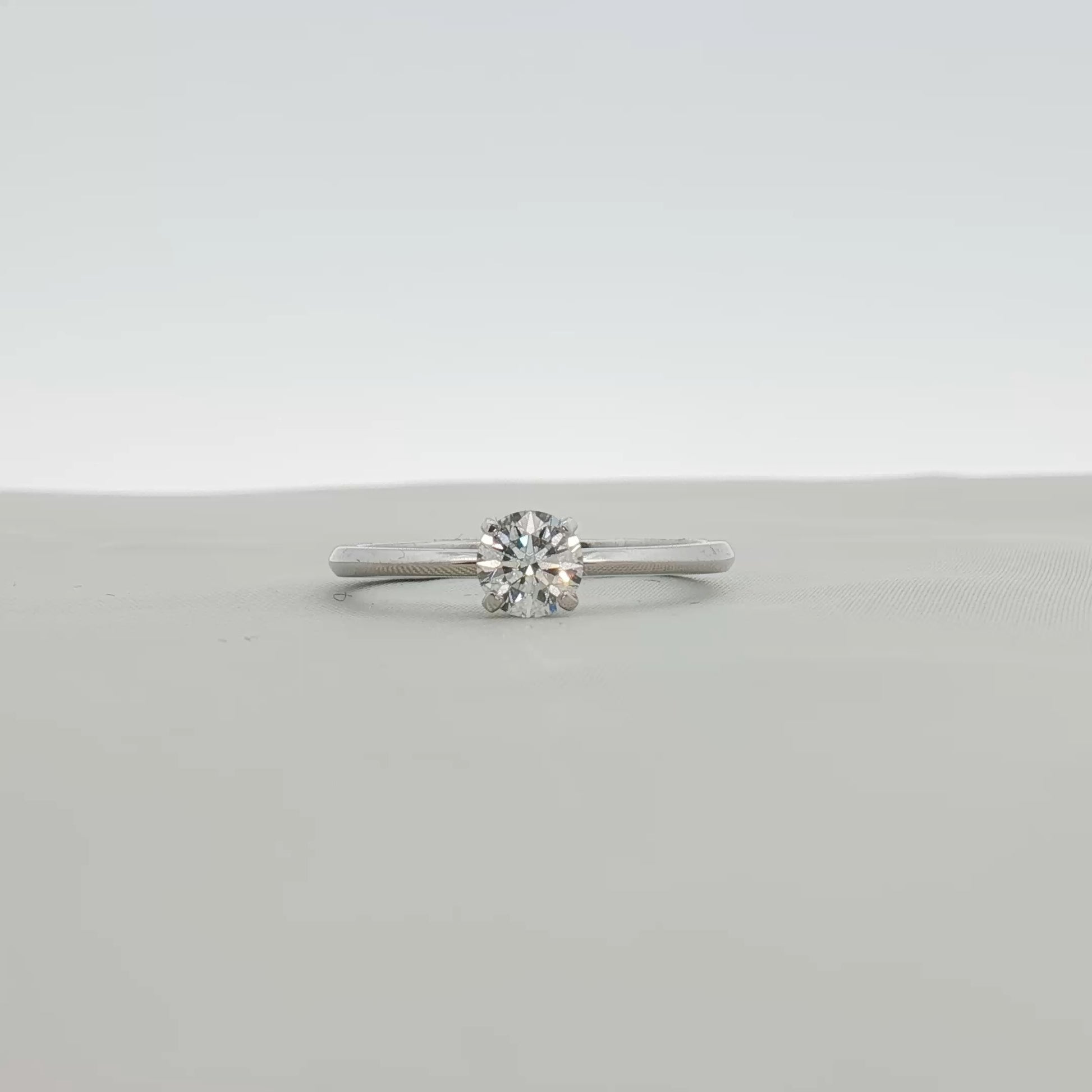 Gold & Beyond Tiffany & Co. True Engagement Ring, elegant gold jewelry with a sparkling central gemstone and intricate band details.