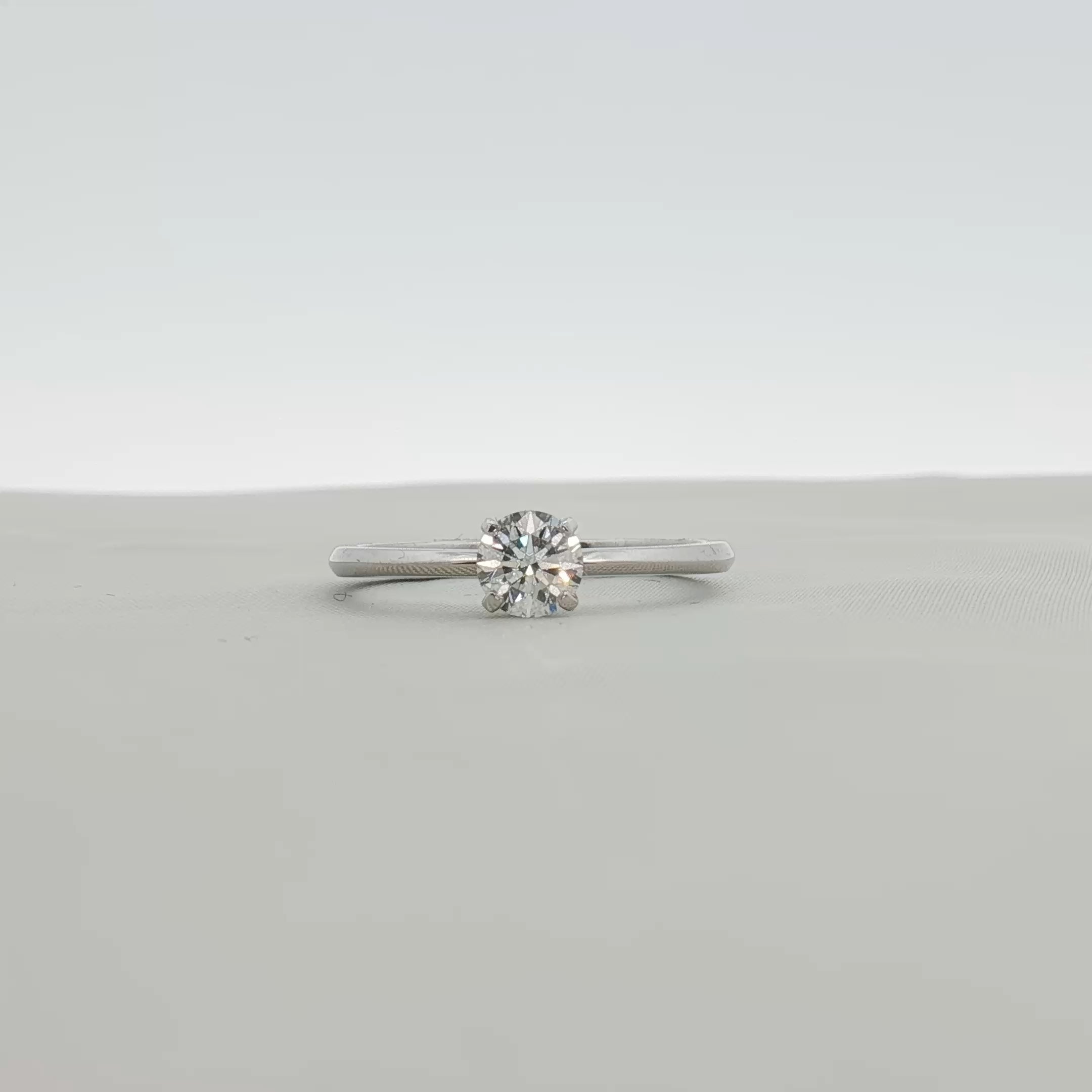 Gold & Beyond Tiffany & Co. True Engagement Ring showcasing a sparkling diamond solitaire on a sleek platinum band