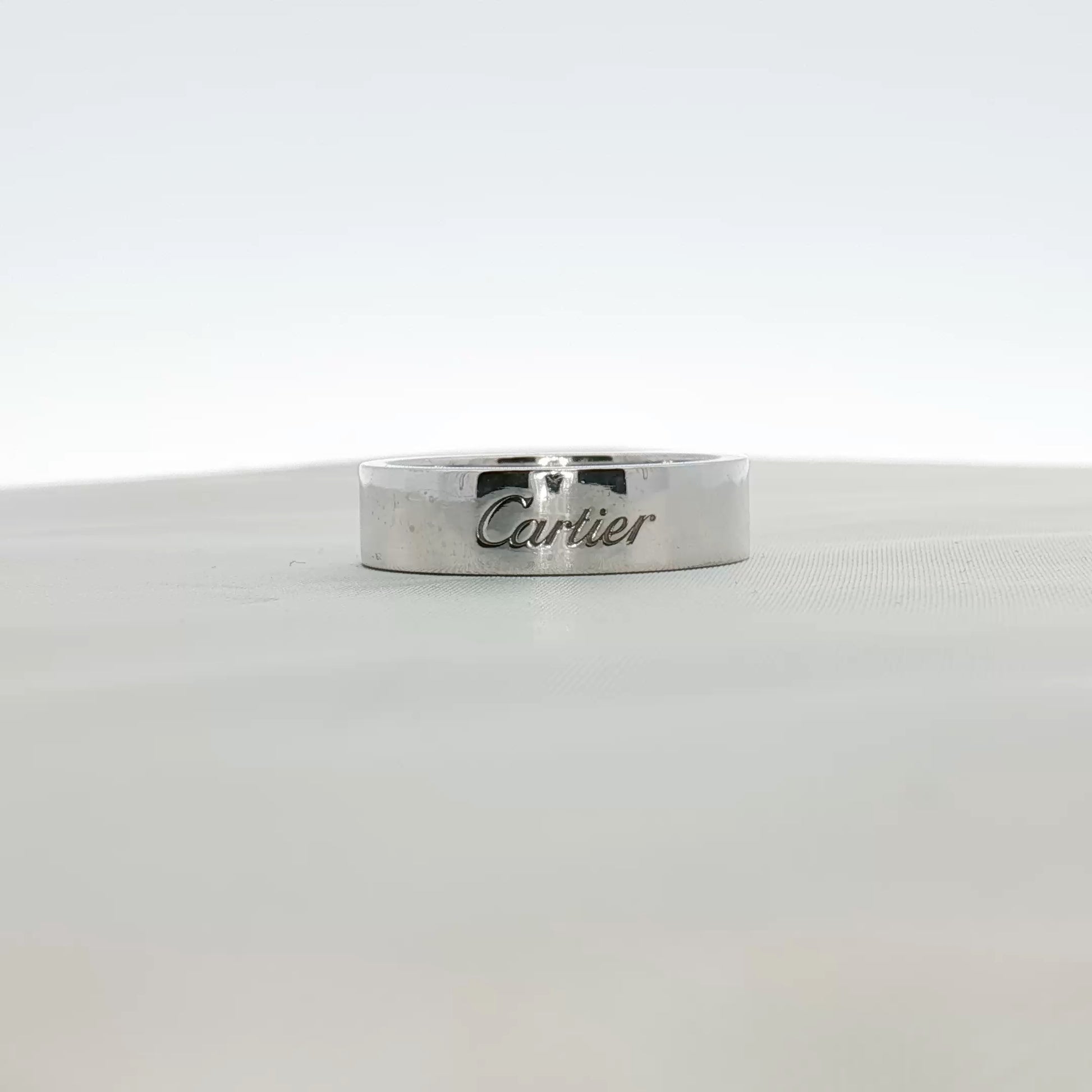 Cartier platinum wedding band ring with a sleek, polished finish, designed for elegant wedding jewelry.