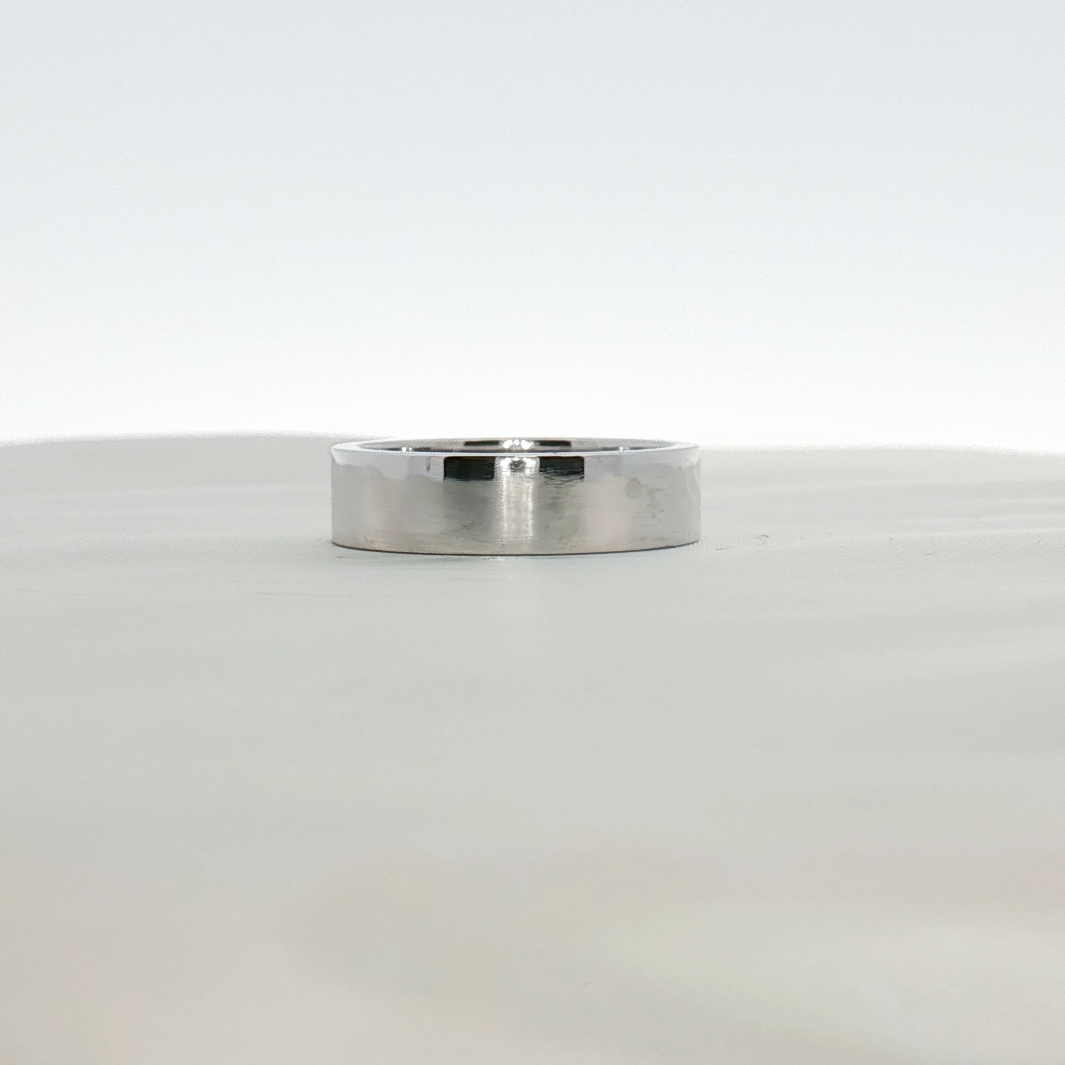 Cartier platinum wedding band ring featuring a sleek, polished design, perfect for elegant wedding jewelry.