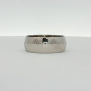 Gold & Beyond gentleman’s wedding band in polished gold, featuring a sleek, classic design suitable for wedding jewelry.