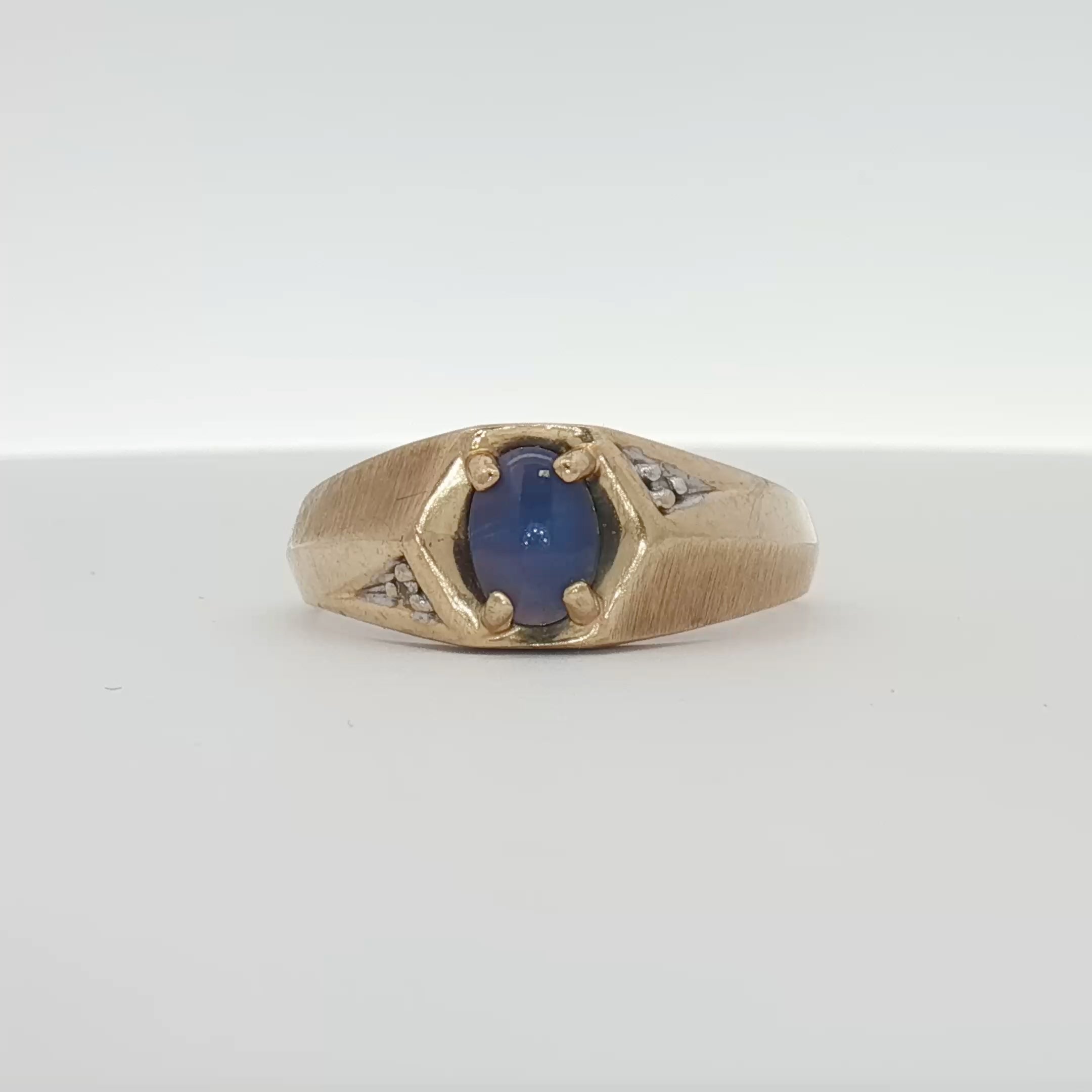 10K gold birthstone ring from Gold & Beyond featuring a colorful gemstone set in a sleek gold band.