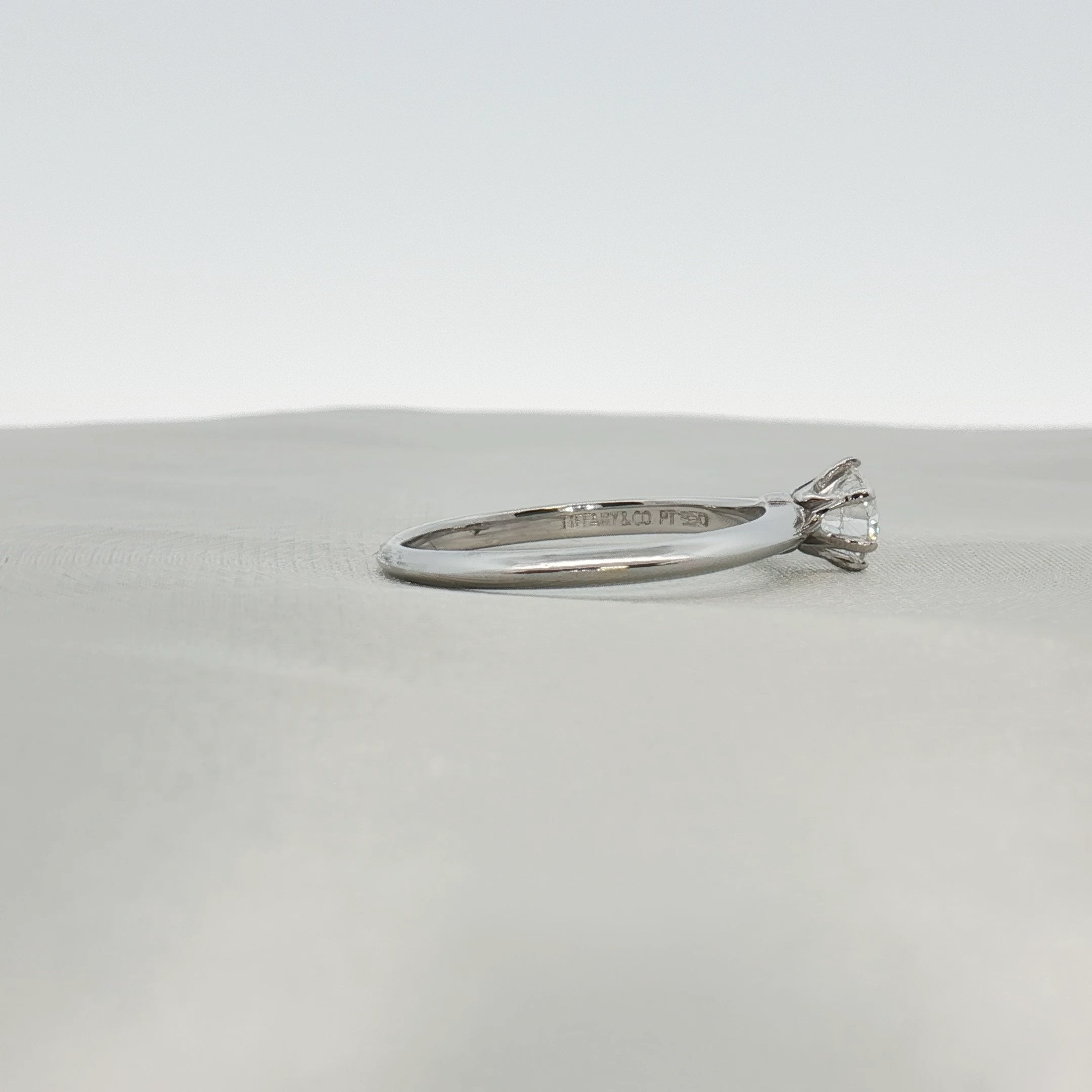 Platinum solitaire engagement ring by Gold & Beyond featuring a single sparkling diamond setting.