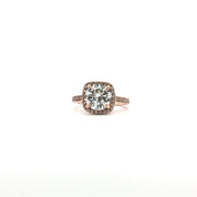 14K tri-color diamond halo ring featuring a central gemstone surrounded by smaller diamonds, crafted by Gold & Beyond.