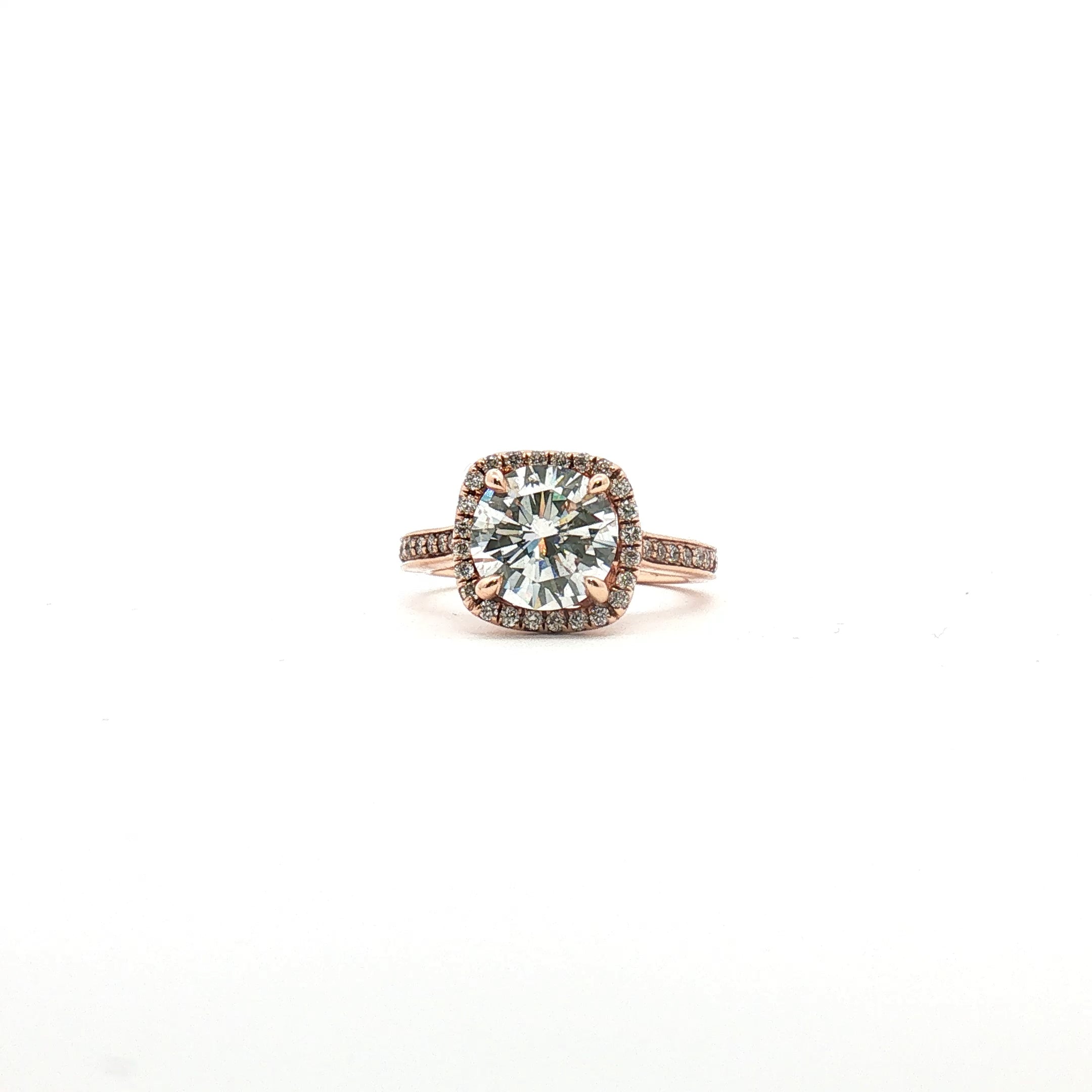 14K tri-color diamond halo ring featuring a central gemstone surrounded by smaller diamonds, crafted by Gold & Beyond.