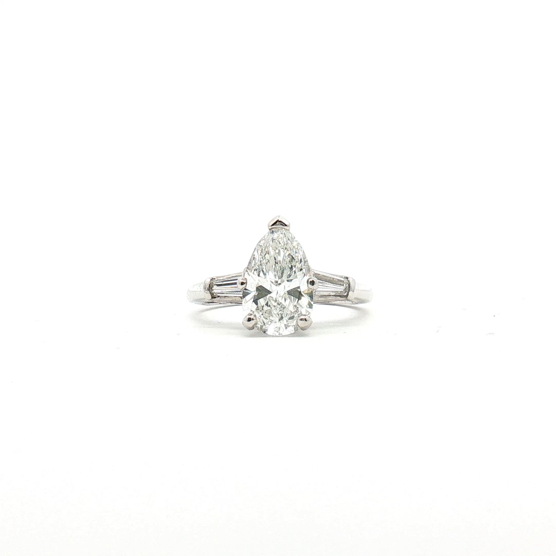 Platinum Pear Diamond Three-Stone Ring from Gold & Beyond featuring three sparkling pear-shaped diamonds set in elegant jewelry style.