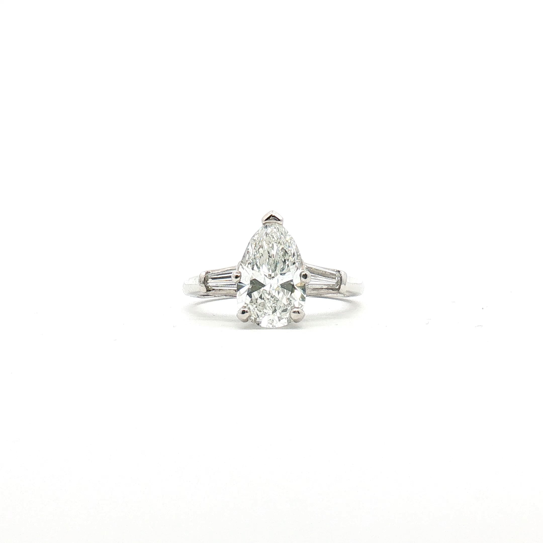 Platinum Pear Diamond Three-Stone Ring from Gold & Beyond featuring three sparkling pear-shaped diamonds set in elegant jewelry style.