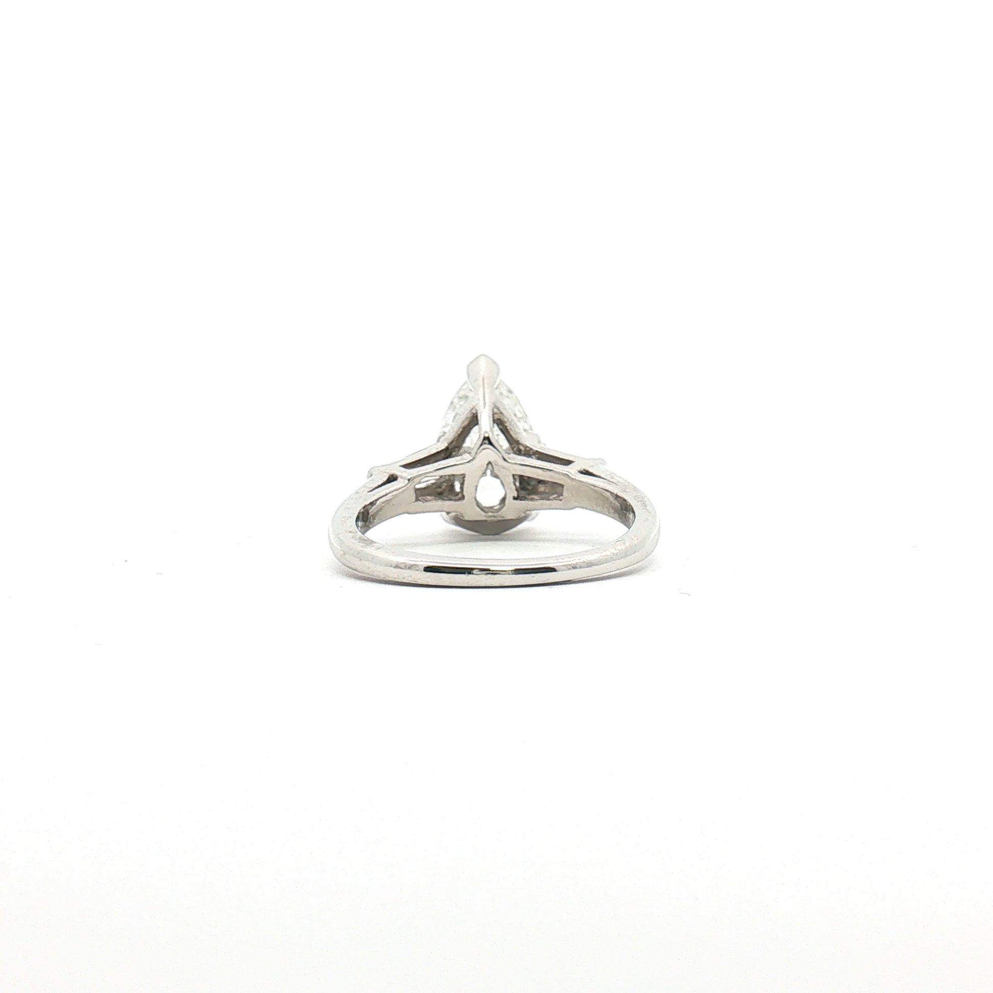 Platinum Pear Diamond Three-Stone Ring showcasing three sparkling pear-shaped diamonds set in elegant jewelry design