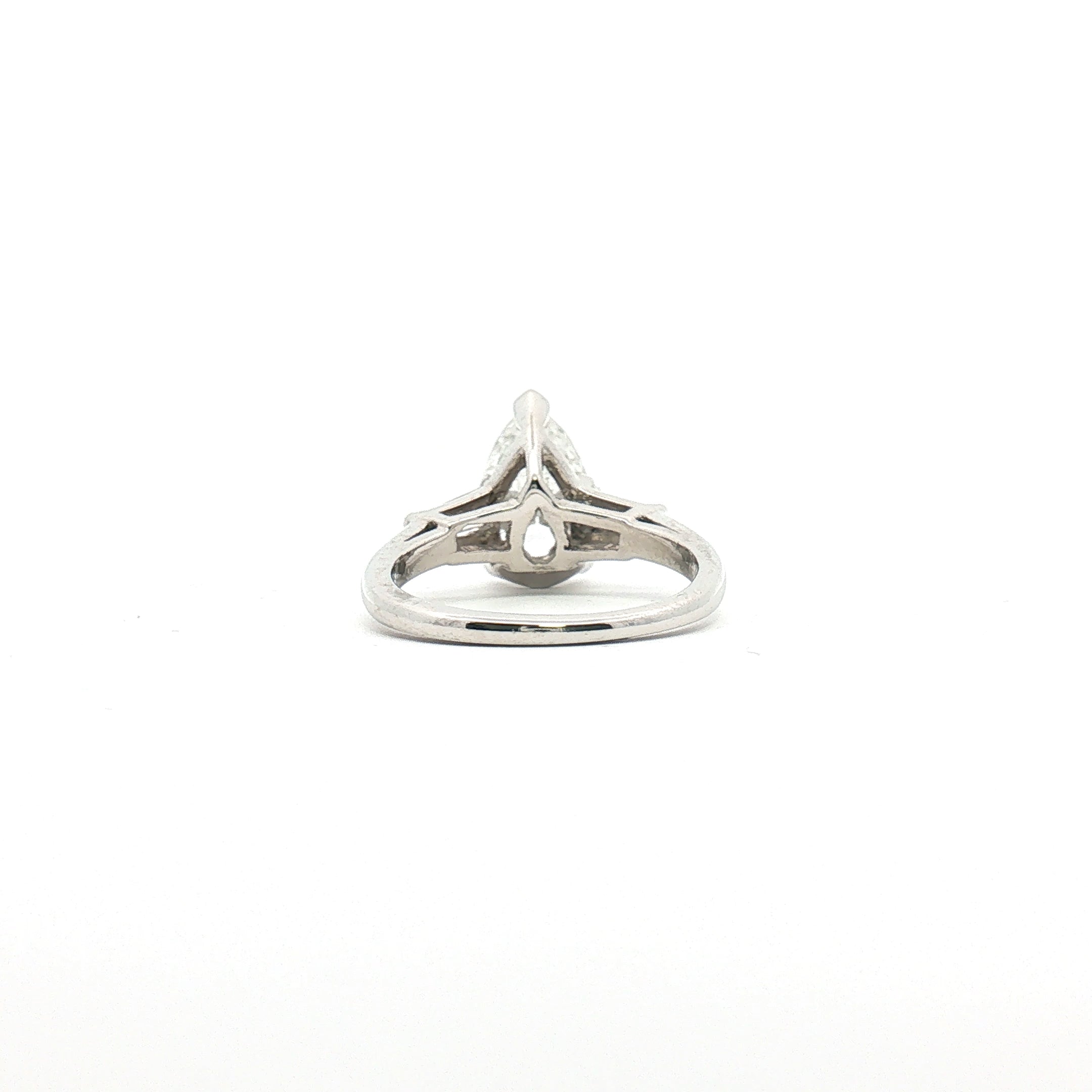 Platinum Pear Diamond Three-Stone Ring showcasing three sparkling pear-shaped diamonds set in elegant jewelry design