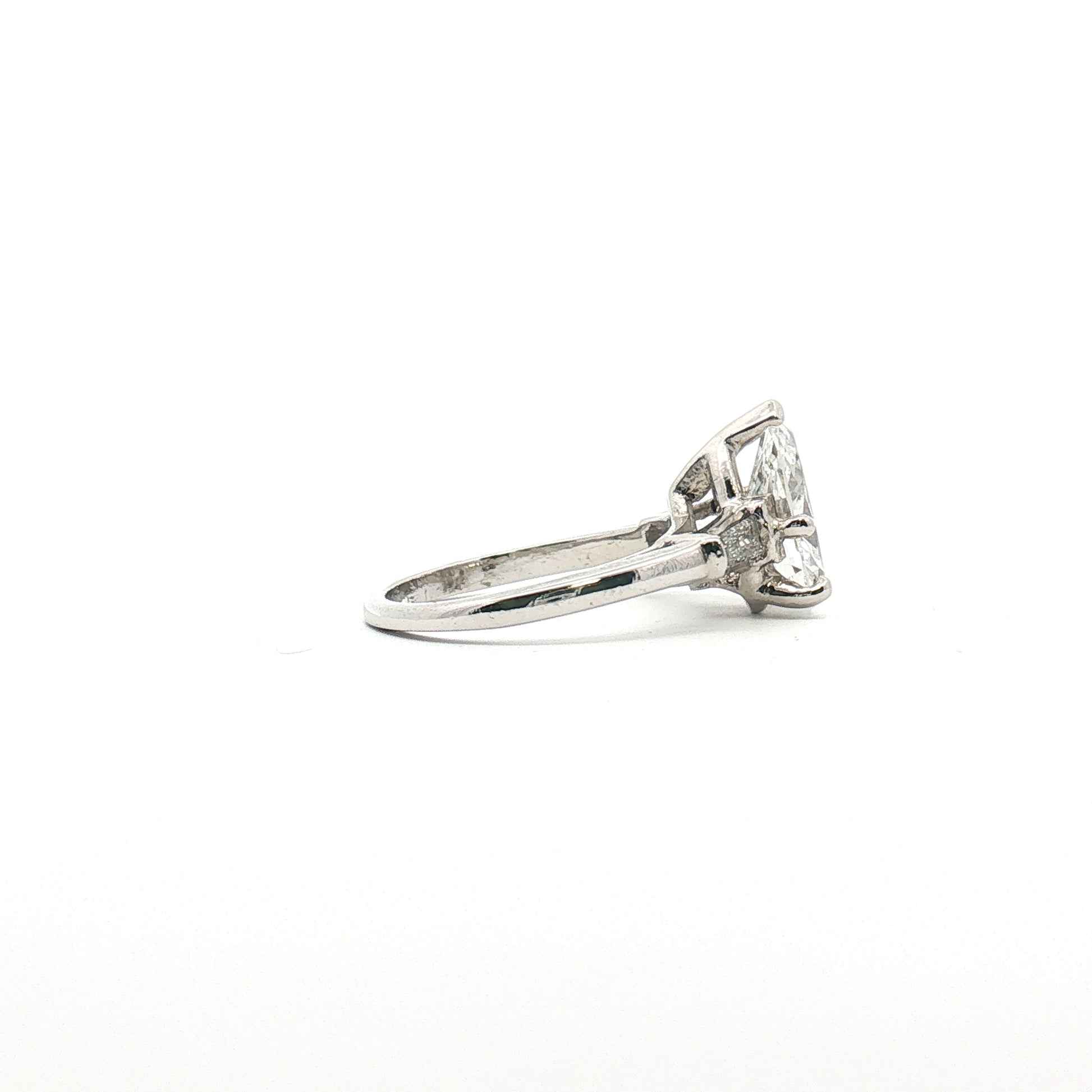Platinum Pear Diamond Three-Stone Ring from Gold & Beyond showing three sparkling pear-shaped diamonds set in a elegant jewelry design