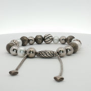Sterling silver beaded bracelet by David Yurman featuring textured beads, worn as stylish jewelry accessory