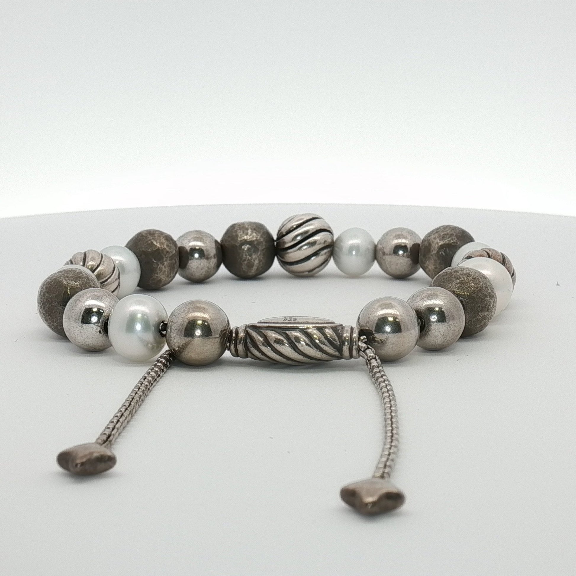 Sterling silver beaded bracelet by David Yurman featuring textured beads, worn as stylish jewelry accessory