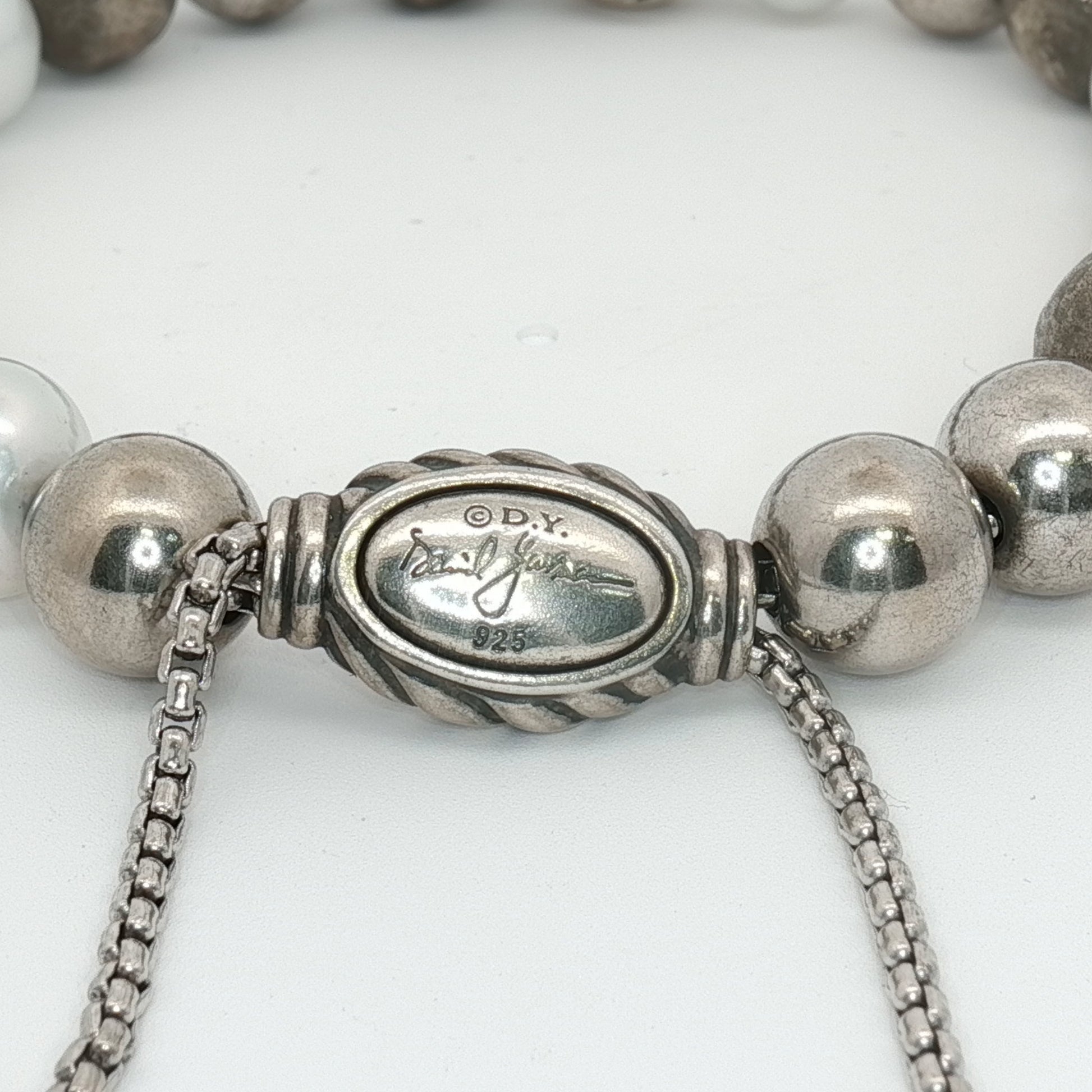 Sterling silver beaded bracelet by David Yurman featuring a sleek, polished design with textured beads.