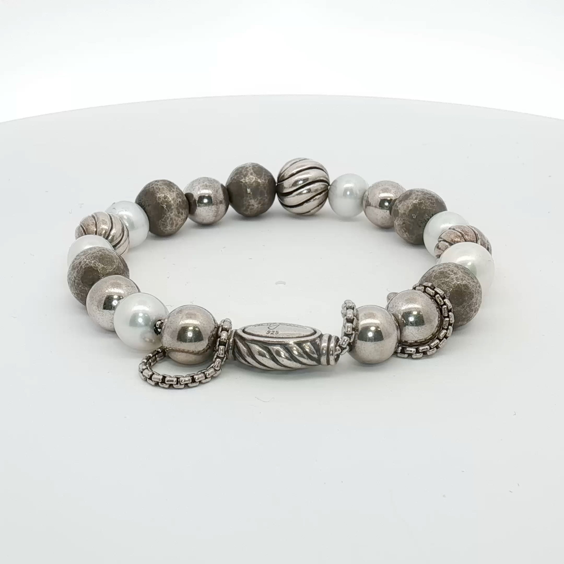 Sterling silver beaded bracelet by David Yurman featuring polished round beads, styled on a jewelry display.