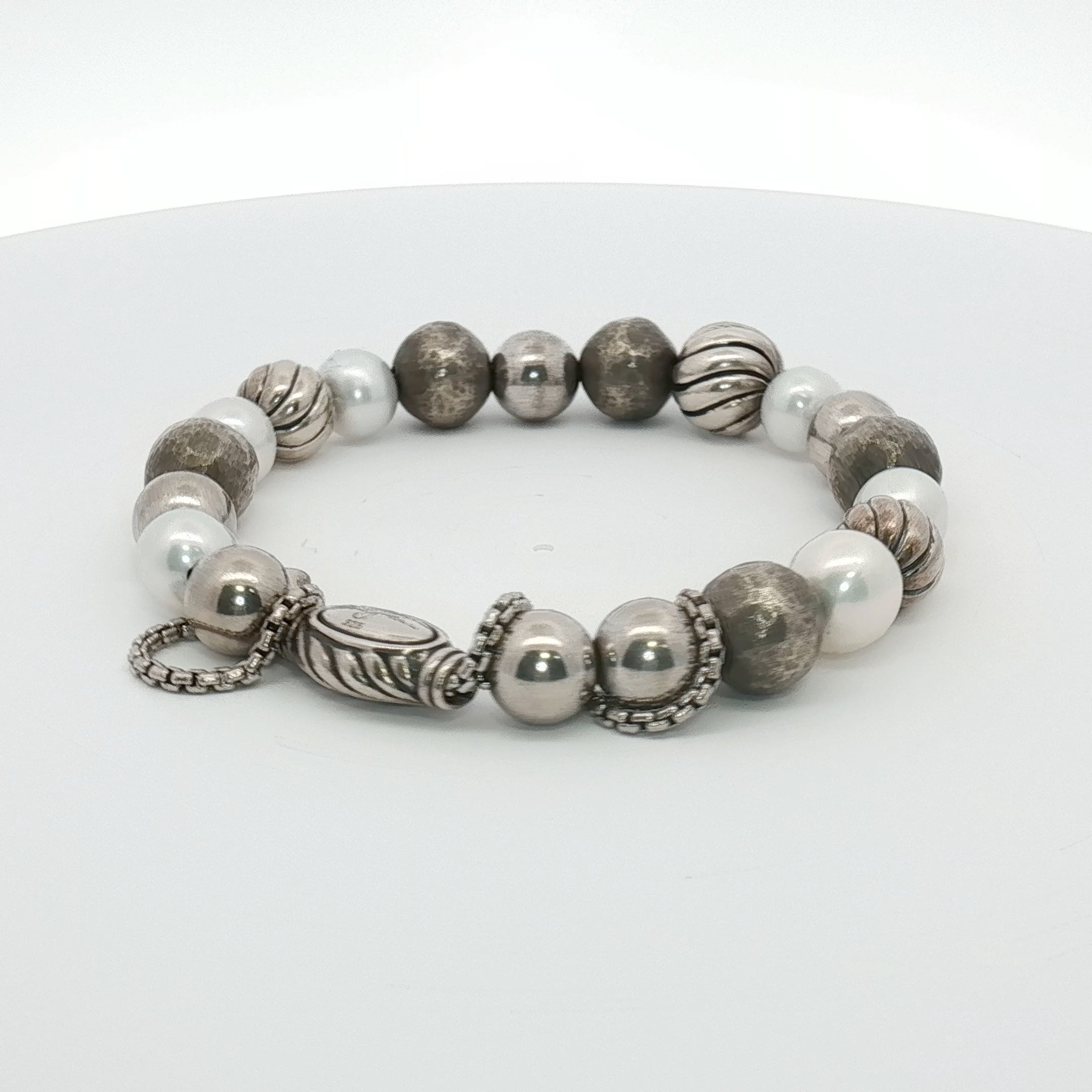 Sterling silver beaded bracelet by David Yurman featuring textured round beads, jewelry style, on a neutral background.