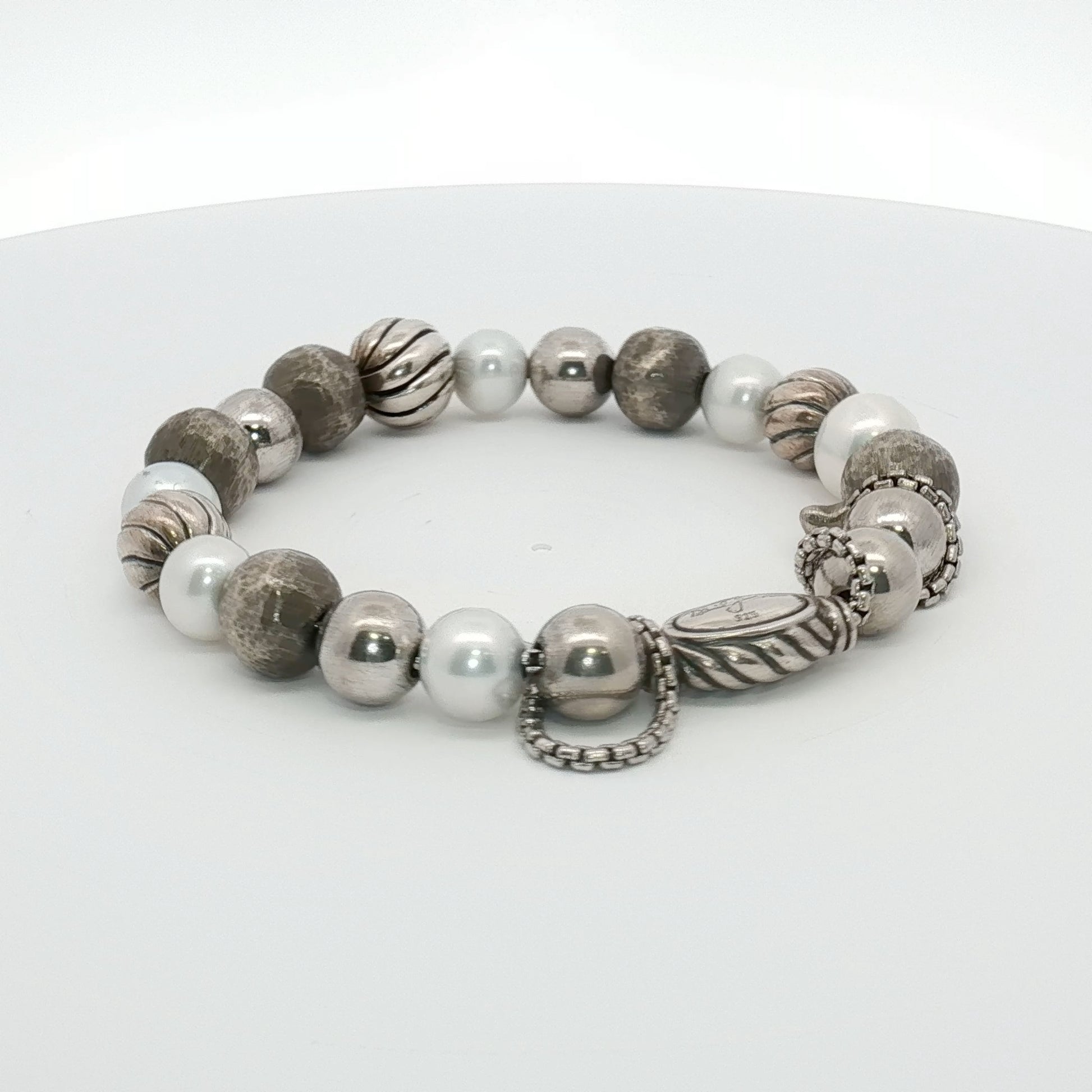 Sterling silver beaded bracelet from David Yurman featuring textured round beads, displayed on a neutral background.