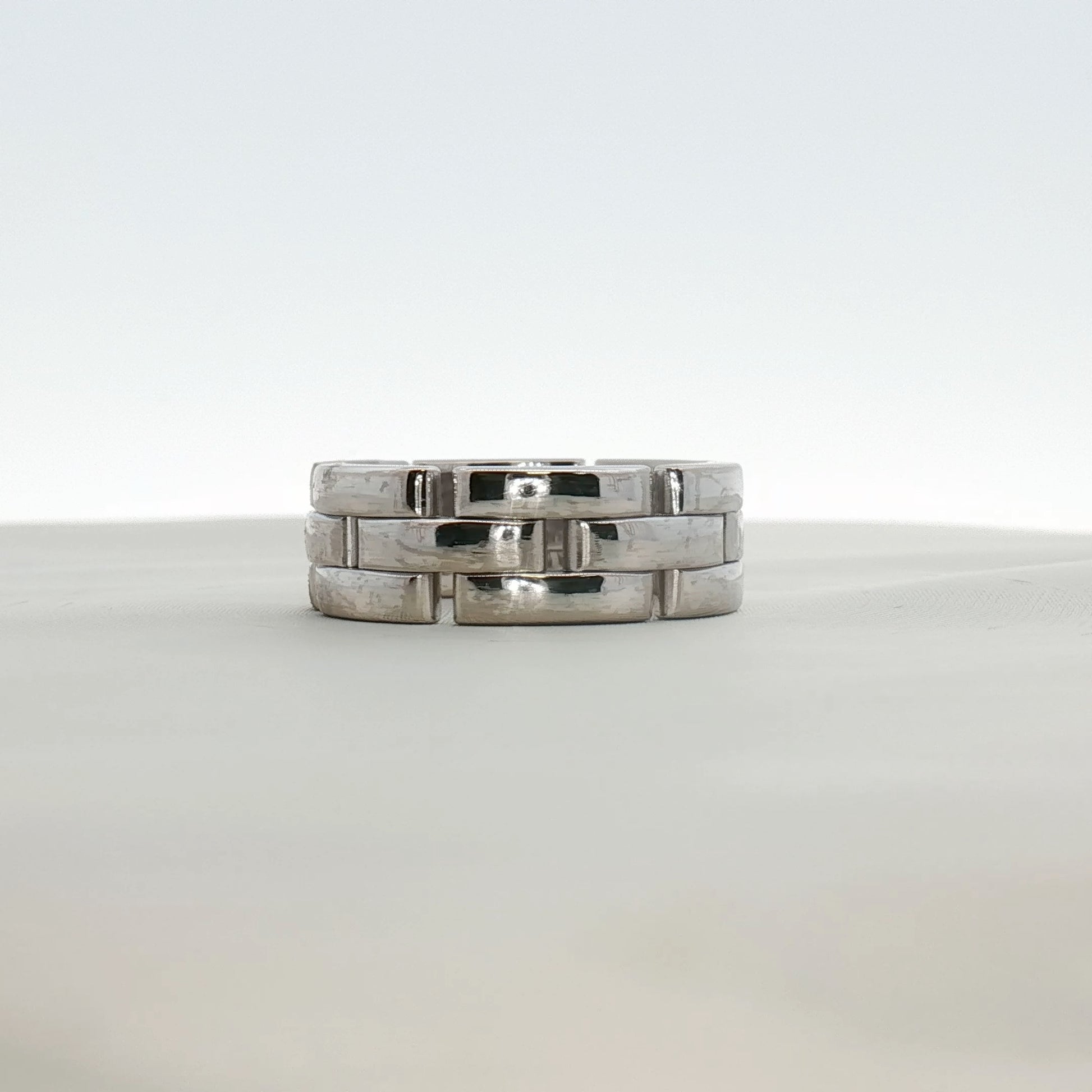 Cartier Maillon Band Ring in gold jewelry featuring linked chain design, showcasing an elegant gold band with intricate detailing.