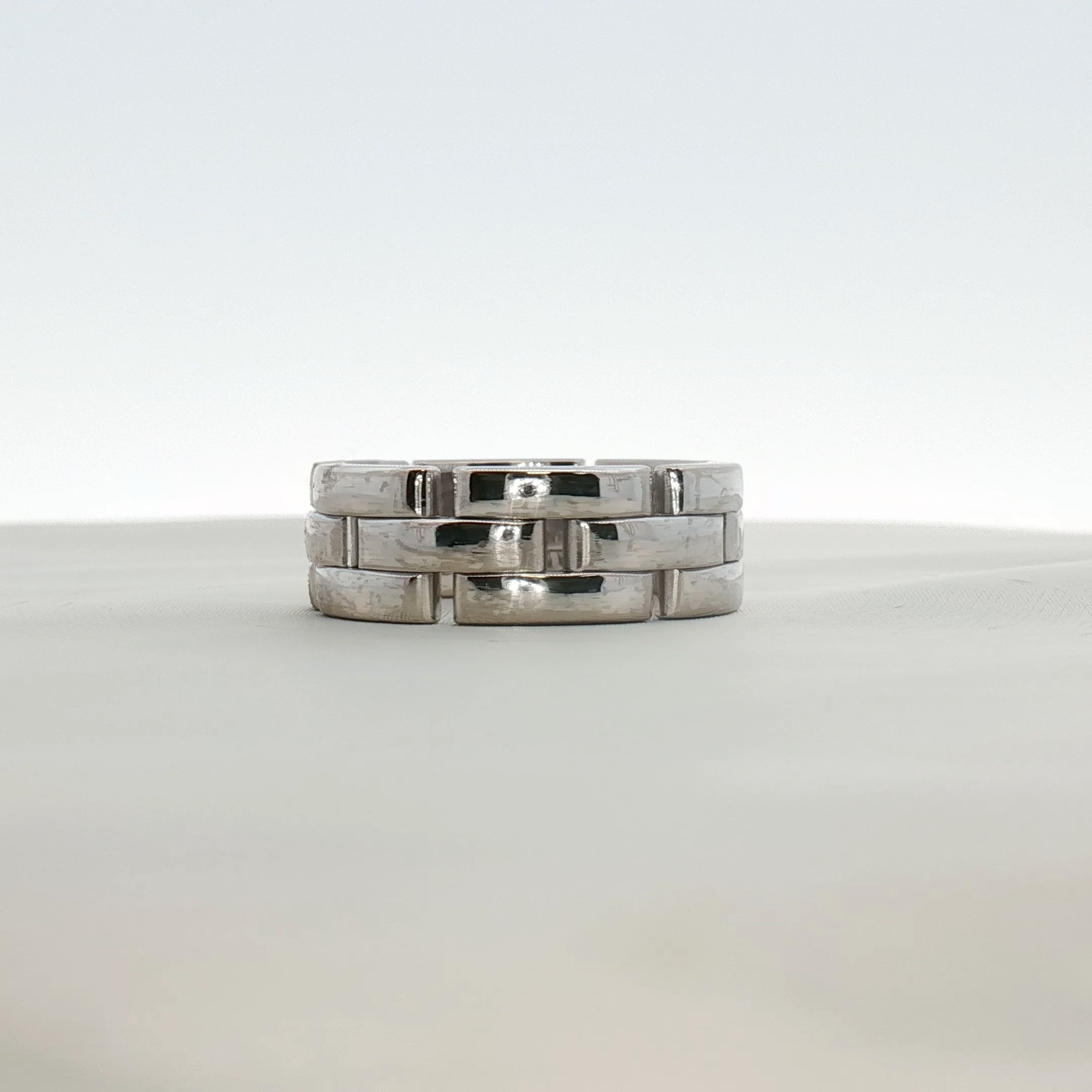Cartier Maillon Band Ring in gold jewelry featuring linked chain design, showcasing an elegant gold band with intricate detailing.