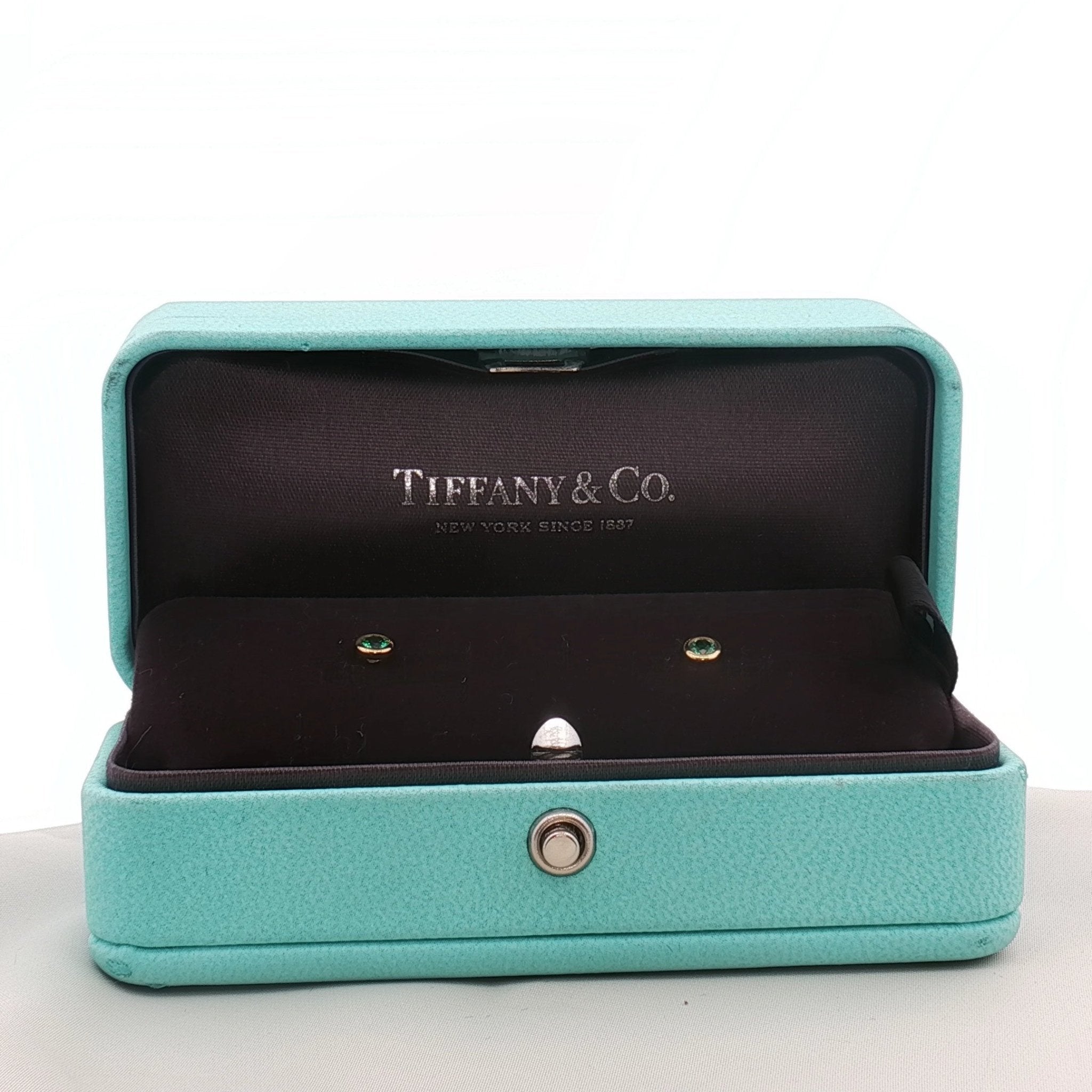 Gold & Beyond Tiffany & Co. 18K yellow gold emerald stud earrings, showcasing sparkling emerald gemstones in classic jewelry style.