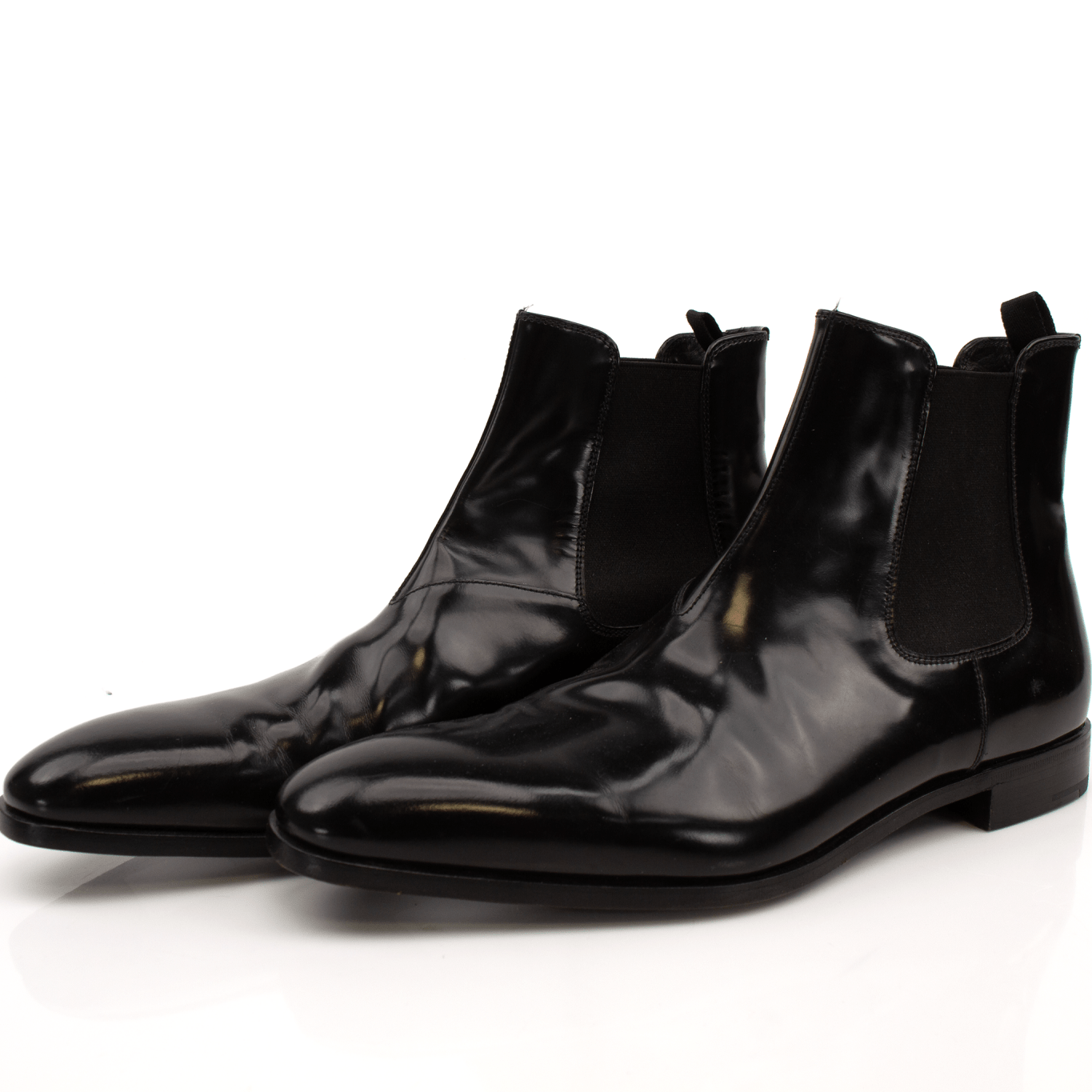 Gold & Beyond Prada men's Chelsea boots, stylish black leather shoes with elastic side panels and sleek design.