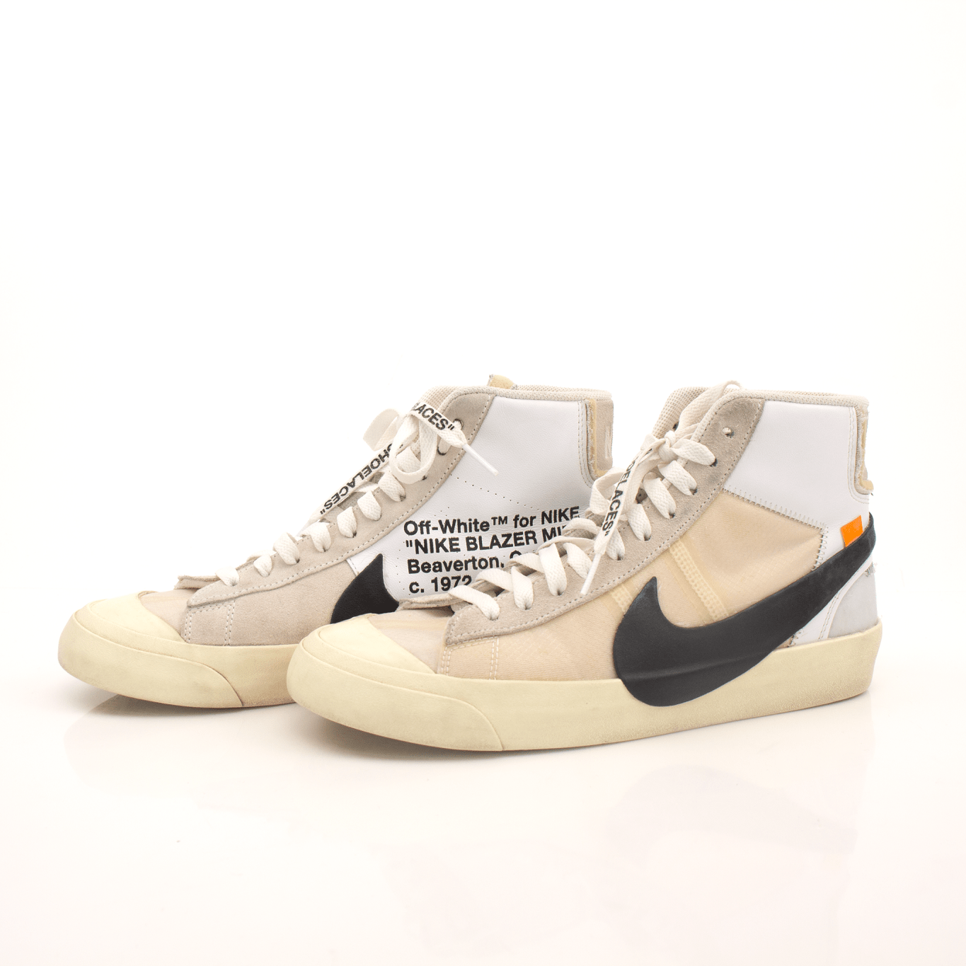 Nike x Off-White Blazer shoes with white leather and signature design details, displayed on a neutral background.