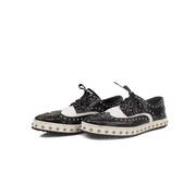 Gold & Beyond Dolce & Gabbana brogues shoes with classic leather design and intricate perforations on a white background.