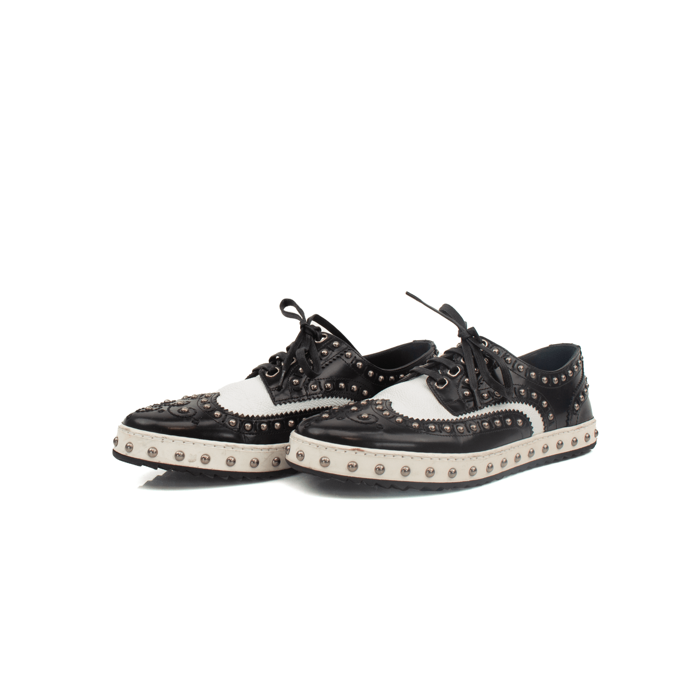 Gold & Beyond Dolce & Gabbana brogues shoes with classic leather design and intricate perforations on a white background.