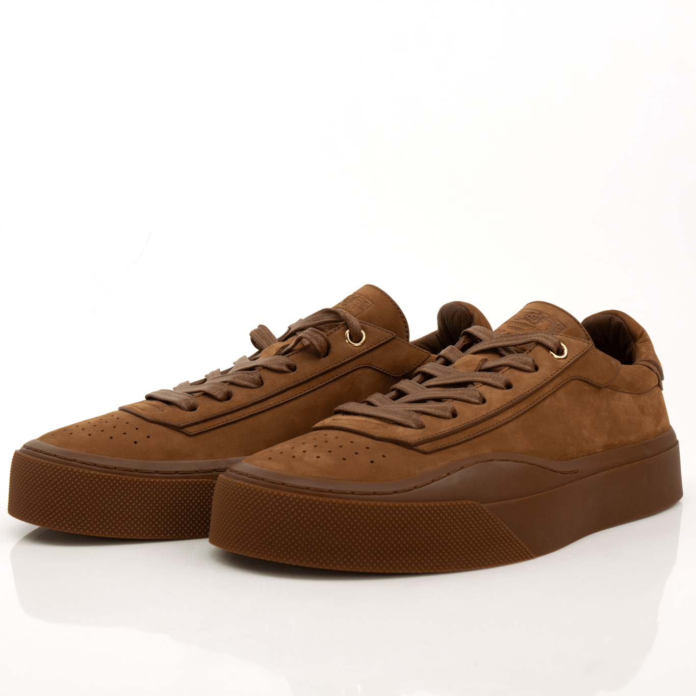 Gold &amp; Beyond Hennessy Hammocks x Kim Jones sneakers, stylish shoes with detailed design and vibrant color accents.