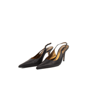 Gold & Beyond Dolce & Gabbana slingback heels with pointed toes and elegant straps on a neutral background.