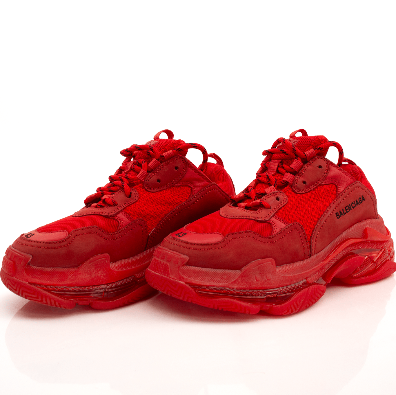 Gold & Beyond Balenciaga Triple S sneakers in white and beige with chunky sole, detailed stitching, and stylish design.