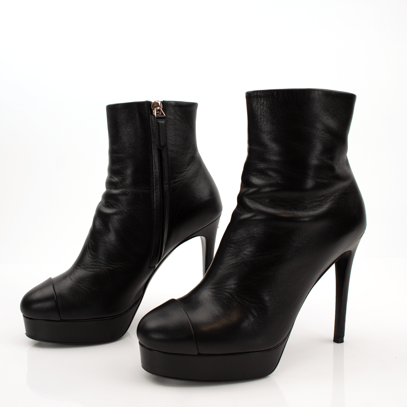 Gold & Beyond Chanel patent leather heels, stylish women's shoes with a sleek, shiny finish and elegant design.