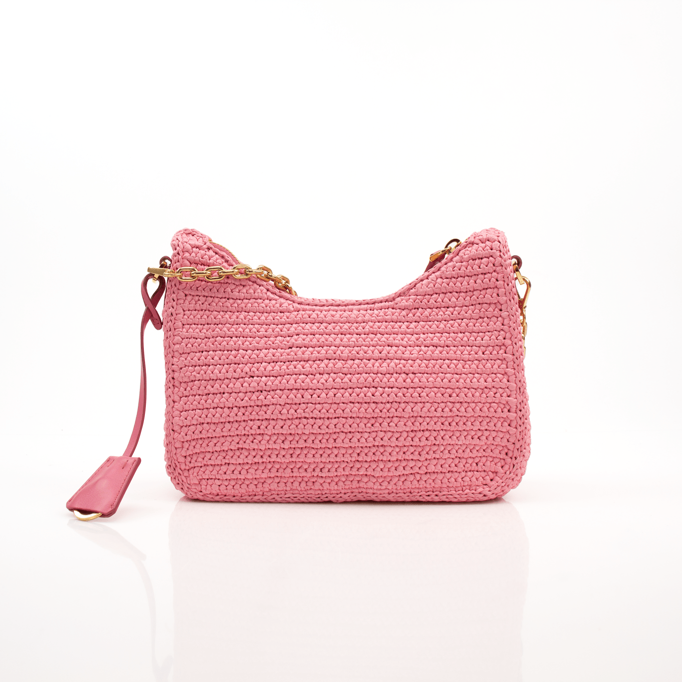 Pink Prada 2005 Re-Edition crochet handbag by Gold & Beyond, featuring intricate crochet details and a stylish hand-held design.