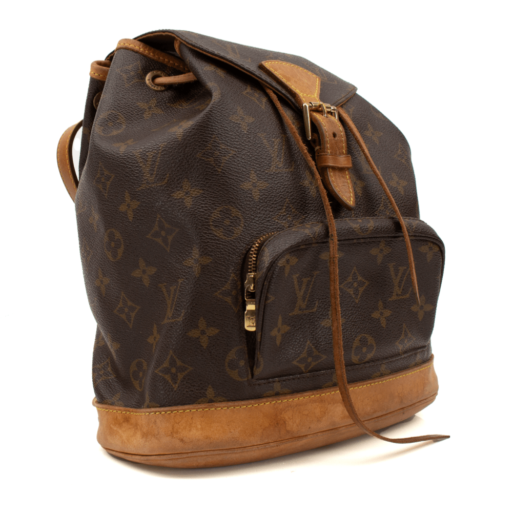 Gold & Beyond Louis Vuitton Montsouris Backpack for travel, featuring black monogram canvas, leather accents, and adjustable straps.