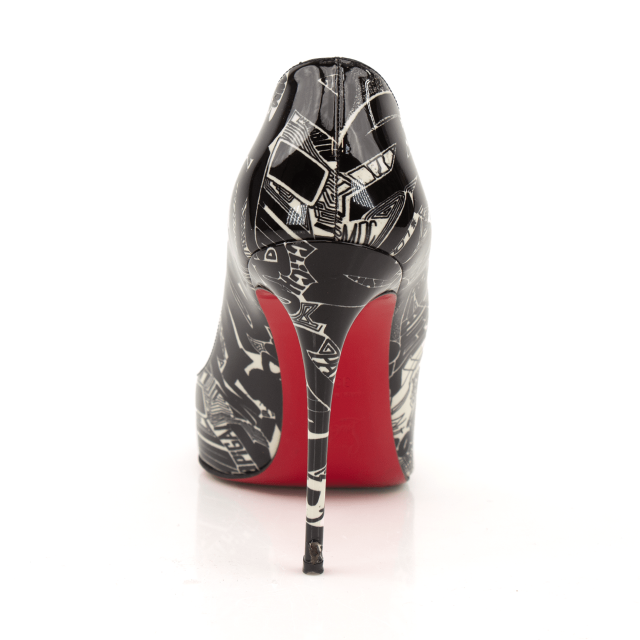 Gold & Beyond Louboutin Graphic Heels featuring bold design, high stiletto heel, and intricate pattern on black background.