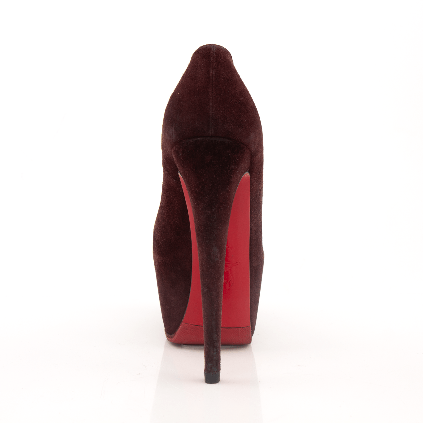 Christian Louboutin Lady Daf suede heels in red, with signature red soles, shown from a side view.