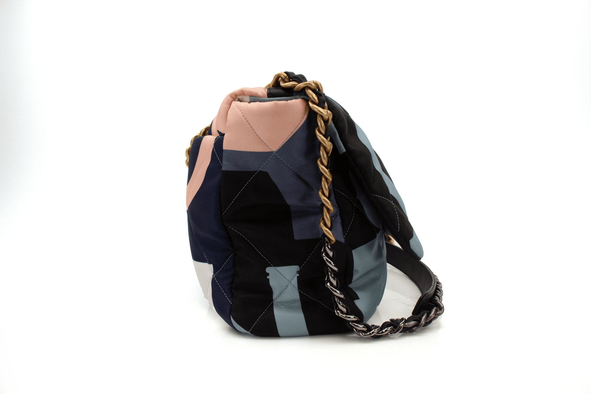 Chanel 19 silk flap handbag by Gold & Beyond, featuring a quilted design and elegant chain strap in a stylish setting.