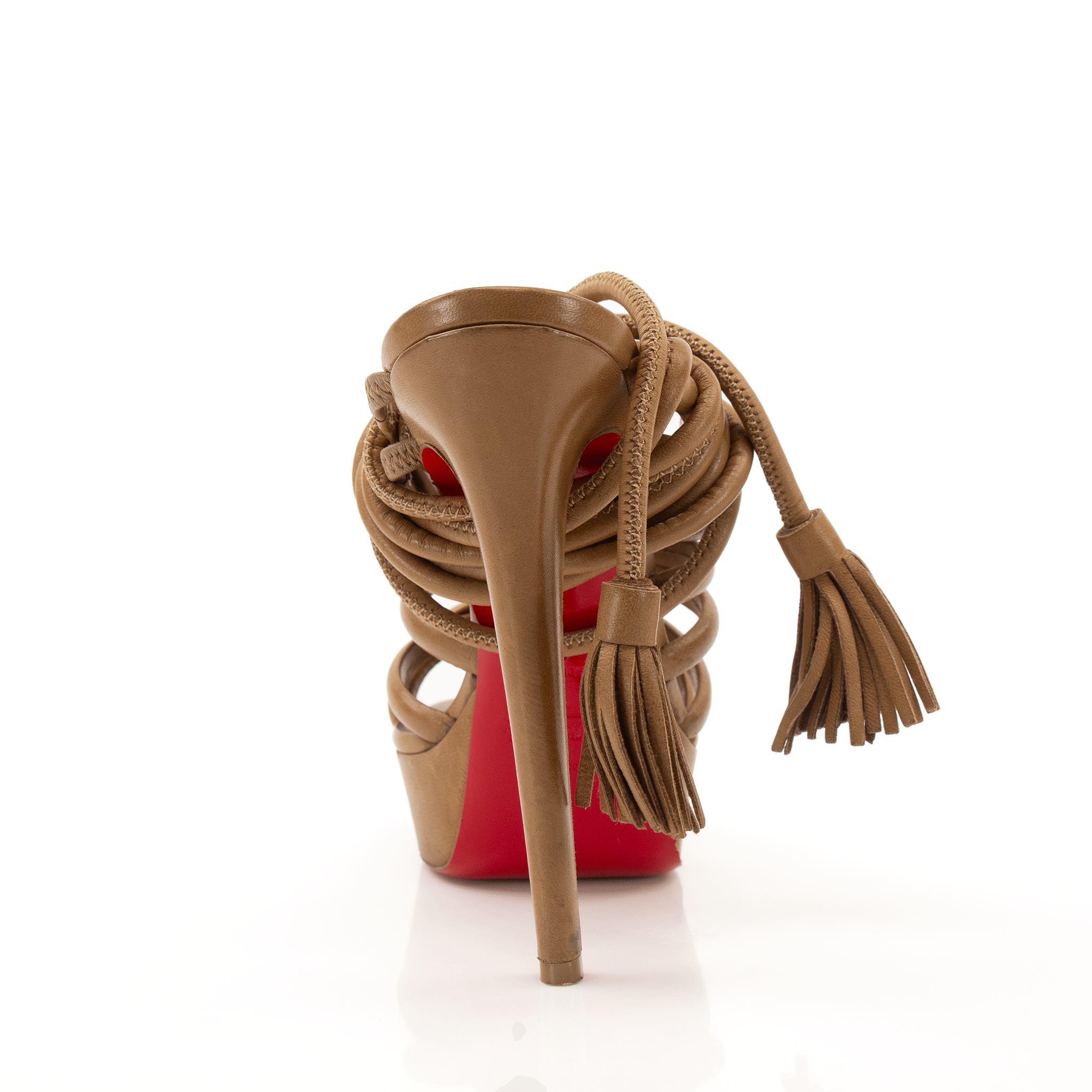 Christian Louboutin tassel platform heels with gold accents and high stiletto heels, featuring elegant tassel details and sleek design.