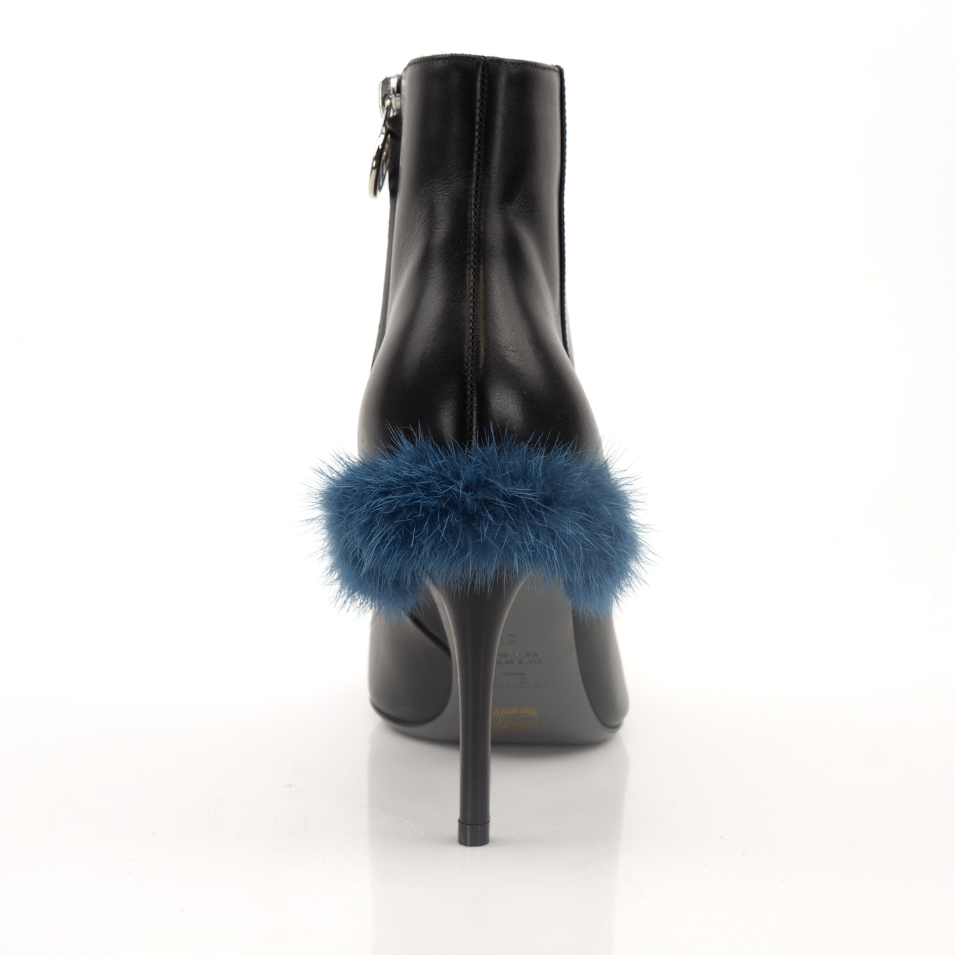 Black leather ankle boots by Fendi, stylish shoes with sleek design and sturdy heel, shown from a side angle.