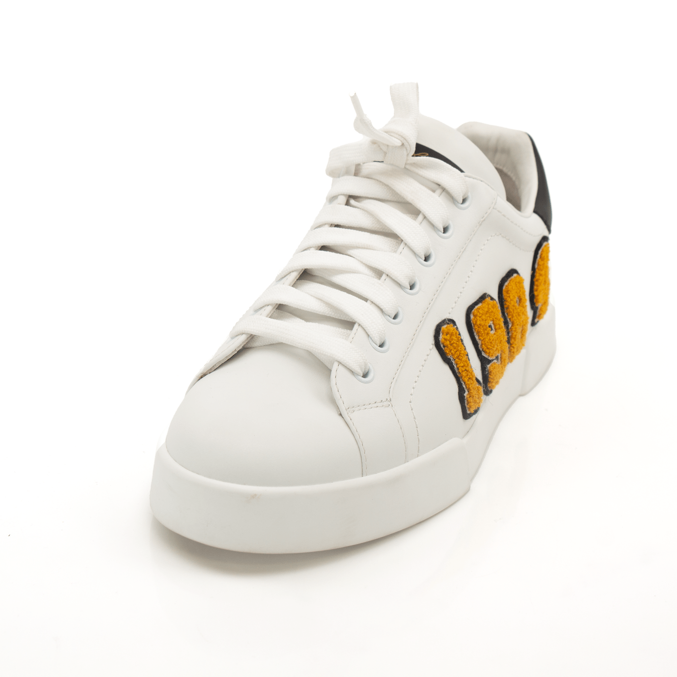 Gold & Beyond Dolce & Gabbana sneakers featuring stylish design, white and gold accents, and comfortable shoe construction.