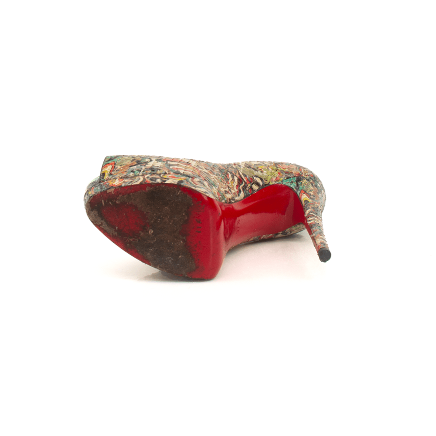 Christian Louboutin Palais Pumps in multicolor with signature red soles, featuring pointed toes and elegant high heels.