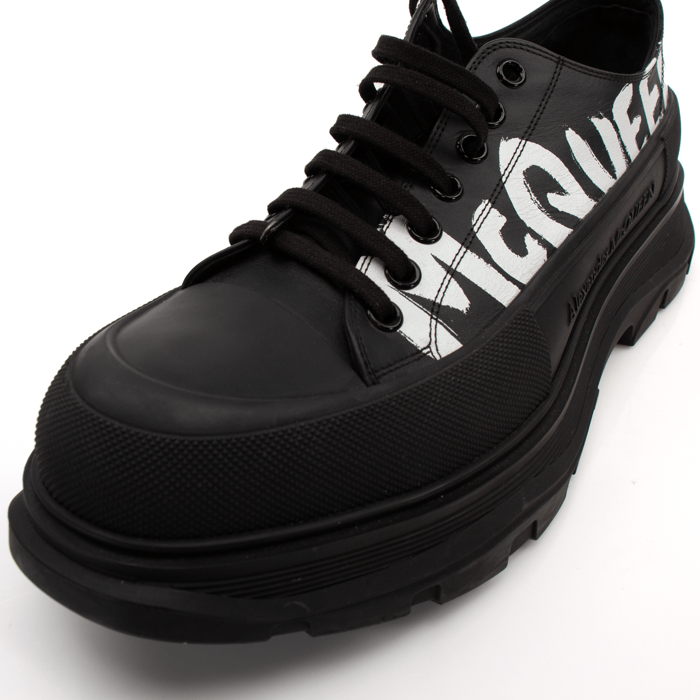 Gold & Beyond Alexander McQueen oversized sneakers with chunky soles and white leather uppers, stylish and trendy footwear.