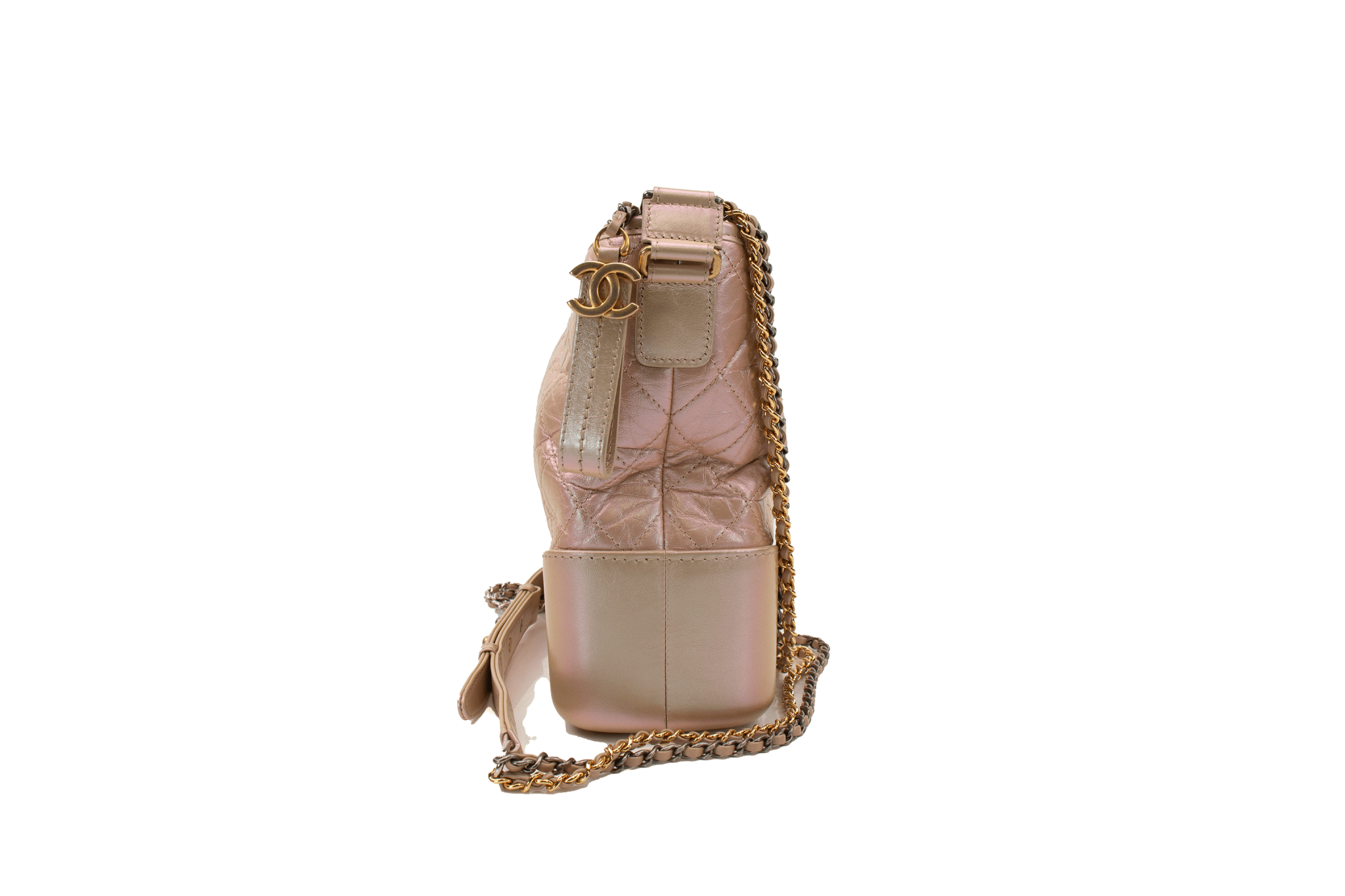 Chanel Gabrielle handbag in elegant design with gold accents and soft leather, showcasing its stylish shape and versatility.