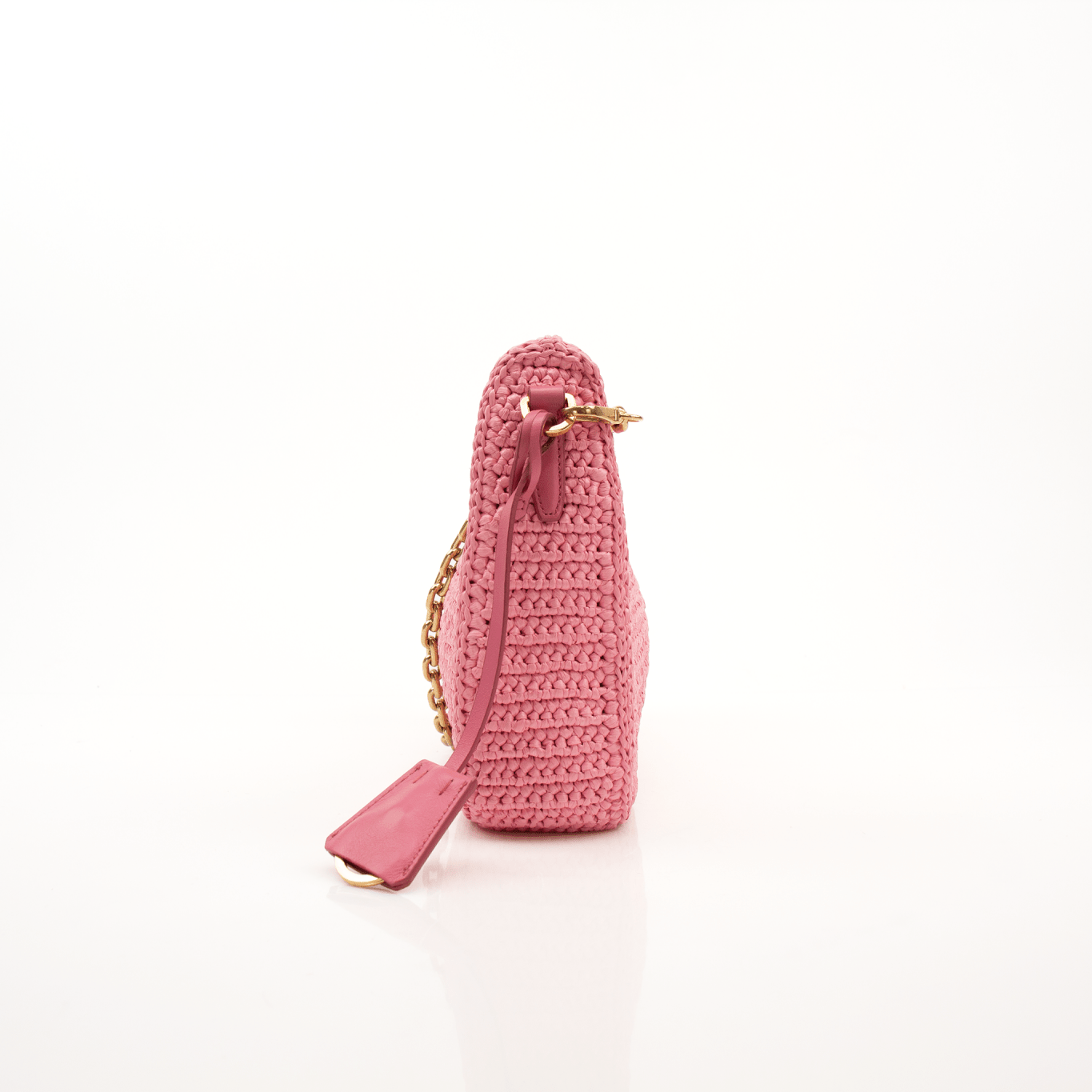 Pink Prada 2005 Re-Edition crochet handbag by Gold & Beyond, showcasing intricate crochet details and a stylish design.