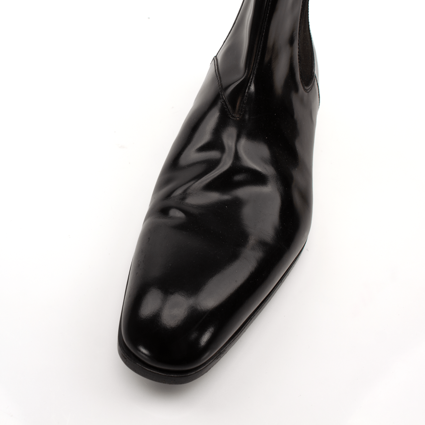 Gold & Beyond Prada men's Chelsea boots, stylish leather shoes with elastic side panels and sleek design.