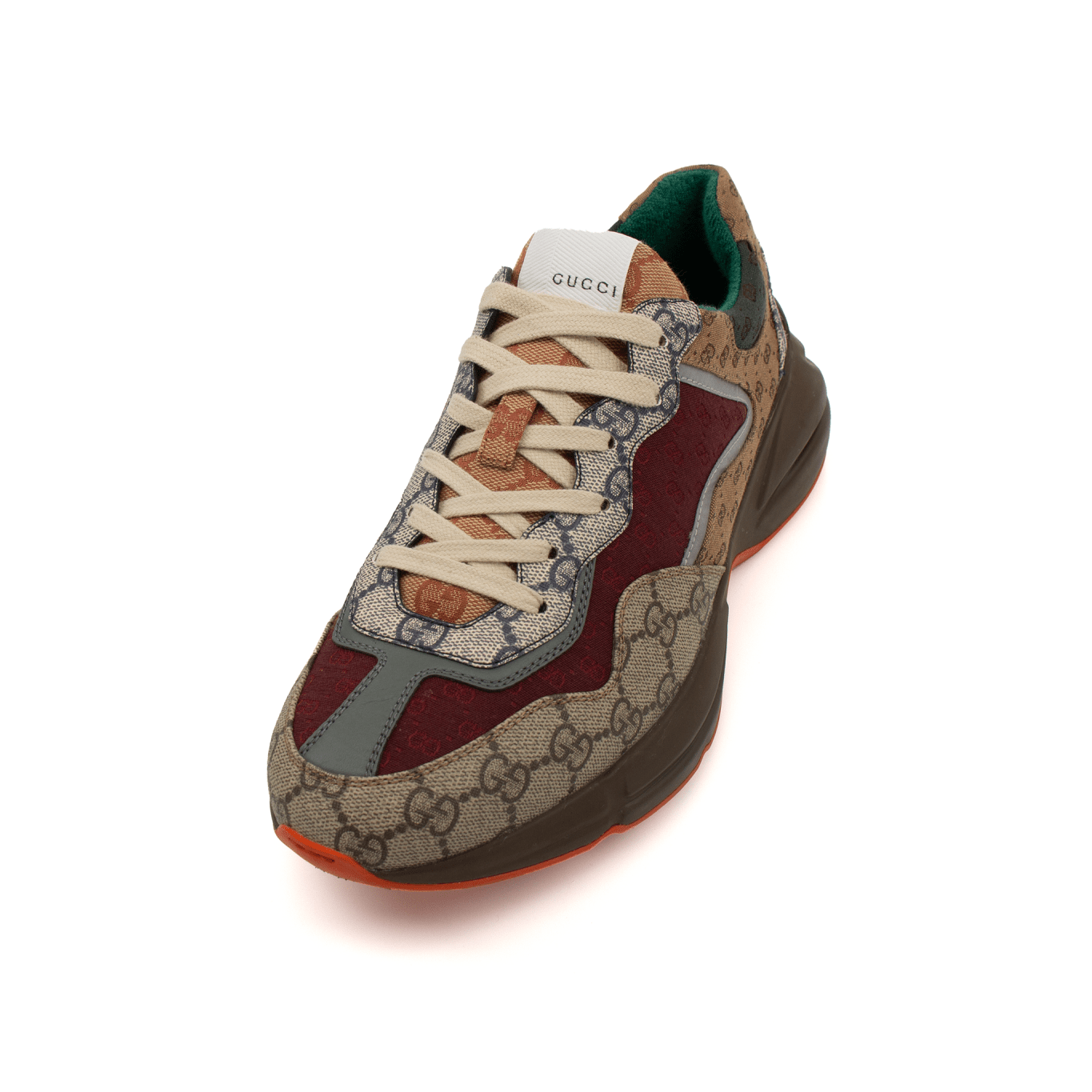 Gold & Beyond Gucci Rhyton Sneakers, stylish men's shoes with a chunky design and Gucci branding, shown in a side view.