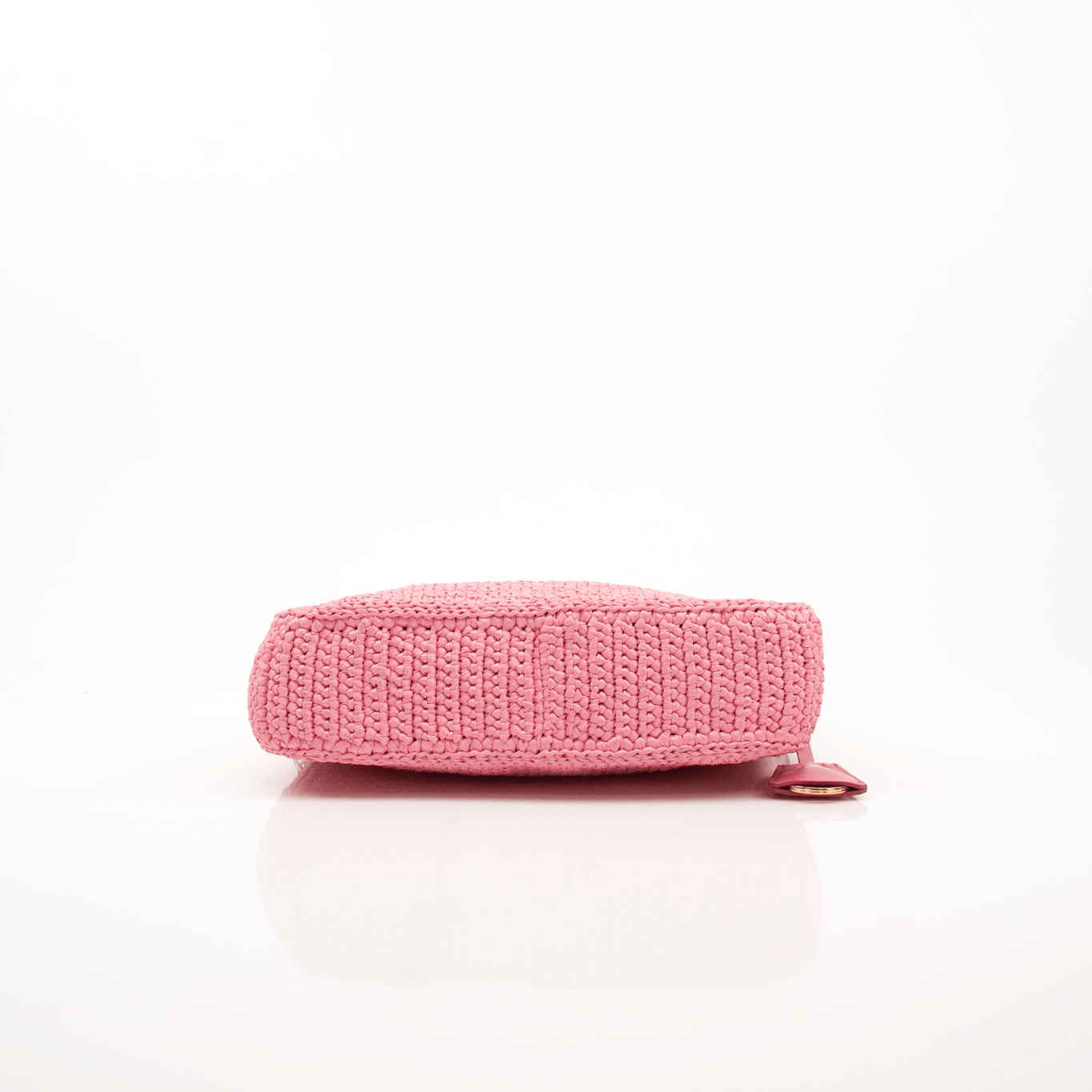 Pink Prada 2005 Re-Edition crochet handbag by Gold & Beyond, featuring intricate crochet details and a stylish hand-held design.