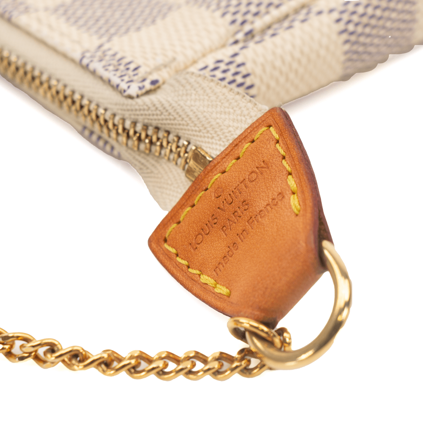 Louis Vuitton Mini Pochette wallet in multicolored canvas with gold-tone hardware and a wrist strap.