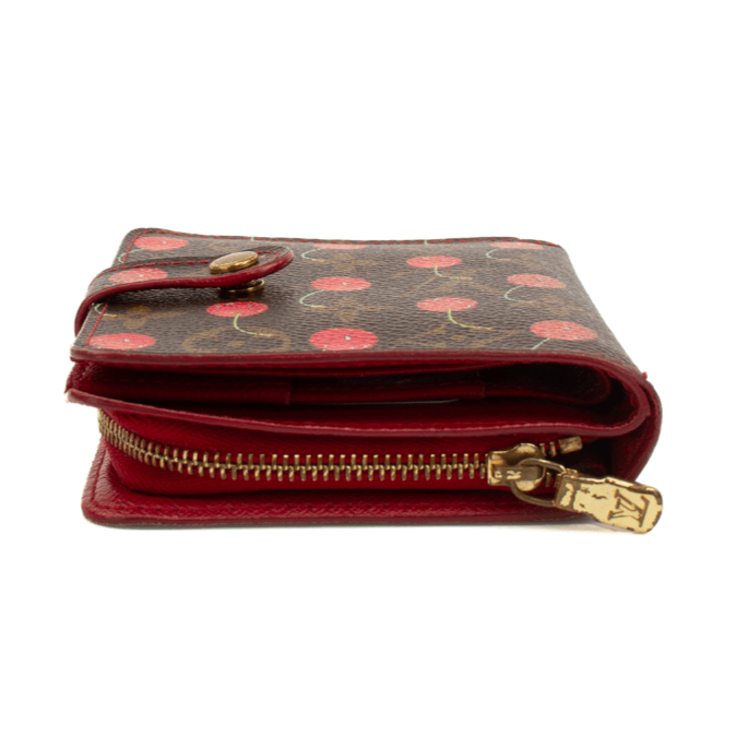 Louis Vuitton Cherry Cerise Zippy Wallet with zip-around closure and Louis Vuitton monogram pattern on fabric.
